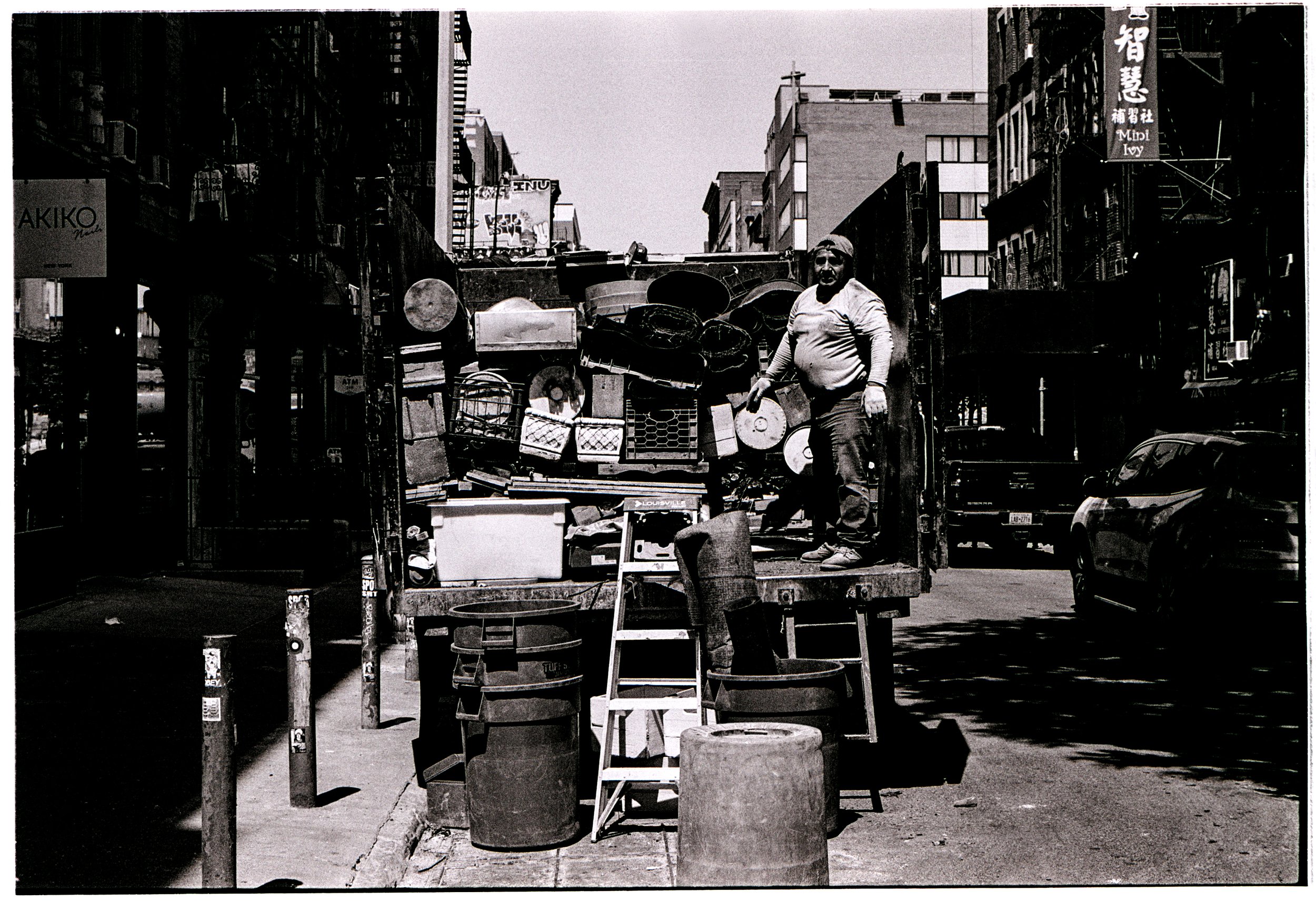 Man Works Filled Truck NYC B&W Film Final.jpg