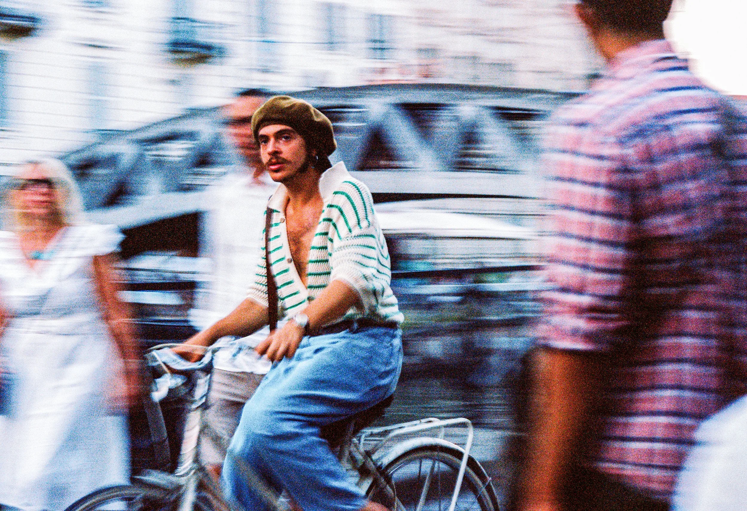 Man Bikes through Dream Crowd Canon F1 Film Milan Official.jpg