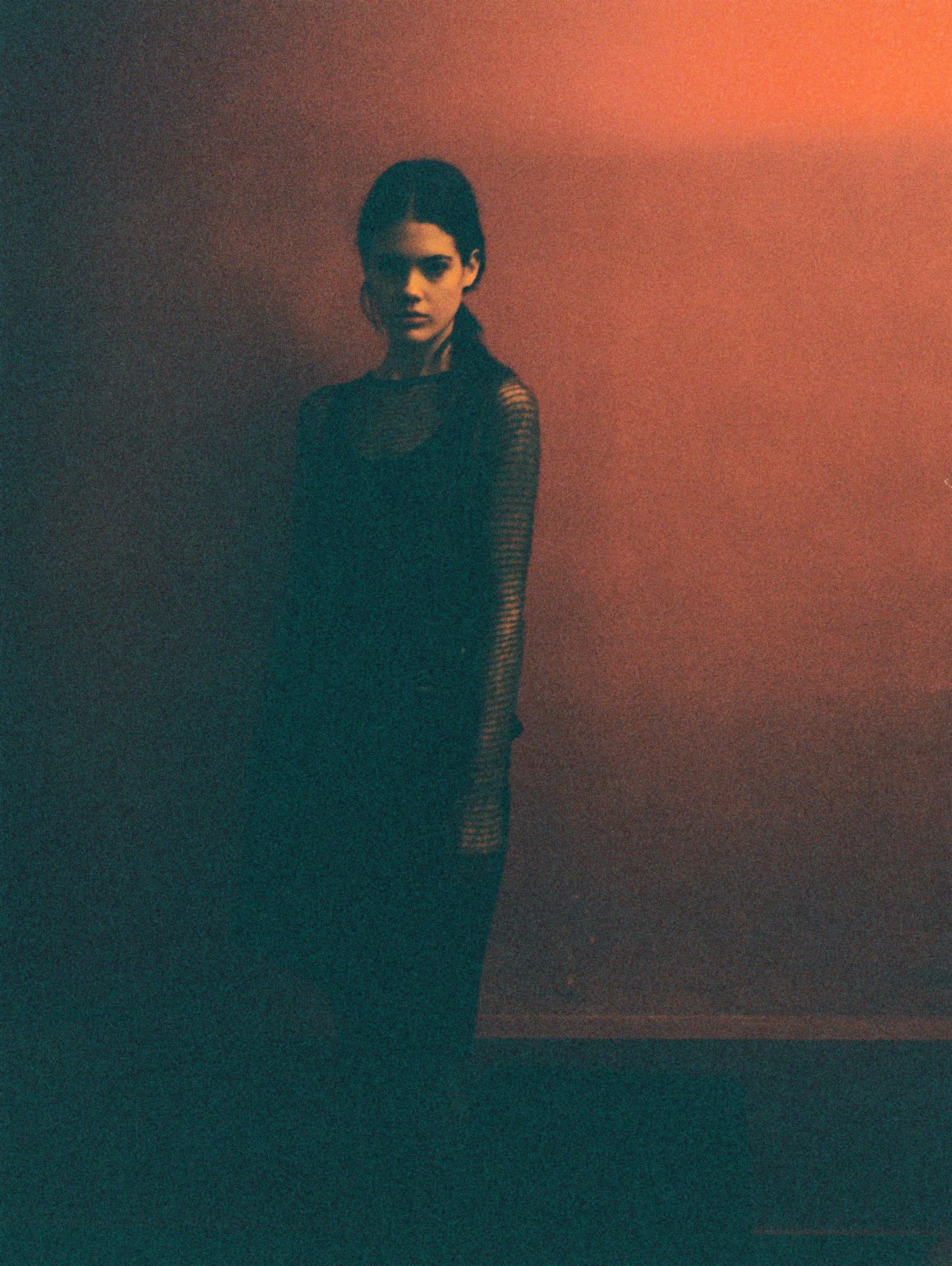 Silk black dress VERONIQUE BRANQUINHO, cashmere and silk fishnet top JEAN COLONNA.