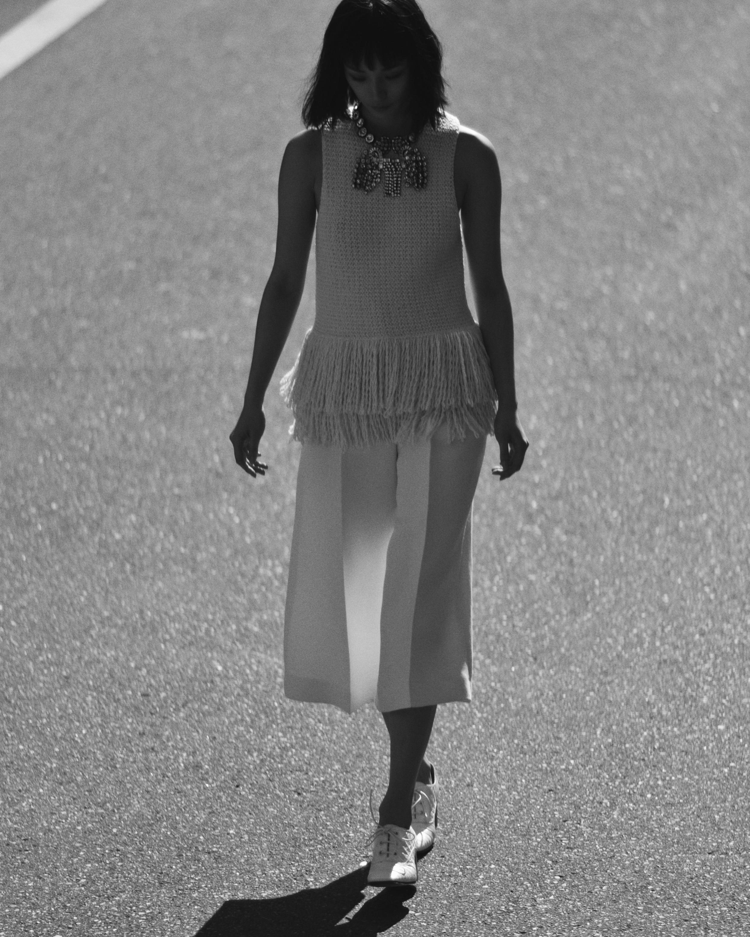  Wool fringed knit top and culottes, brass crystal necklace and stamped crocodile calfskin brogues  CÉLINE.  