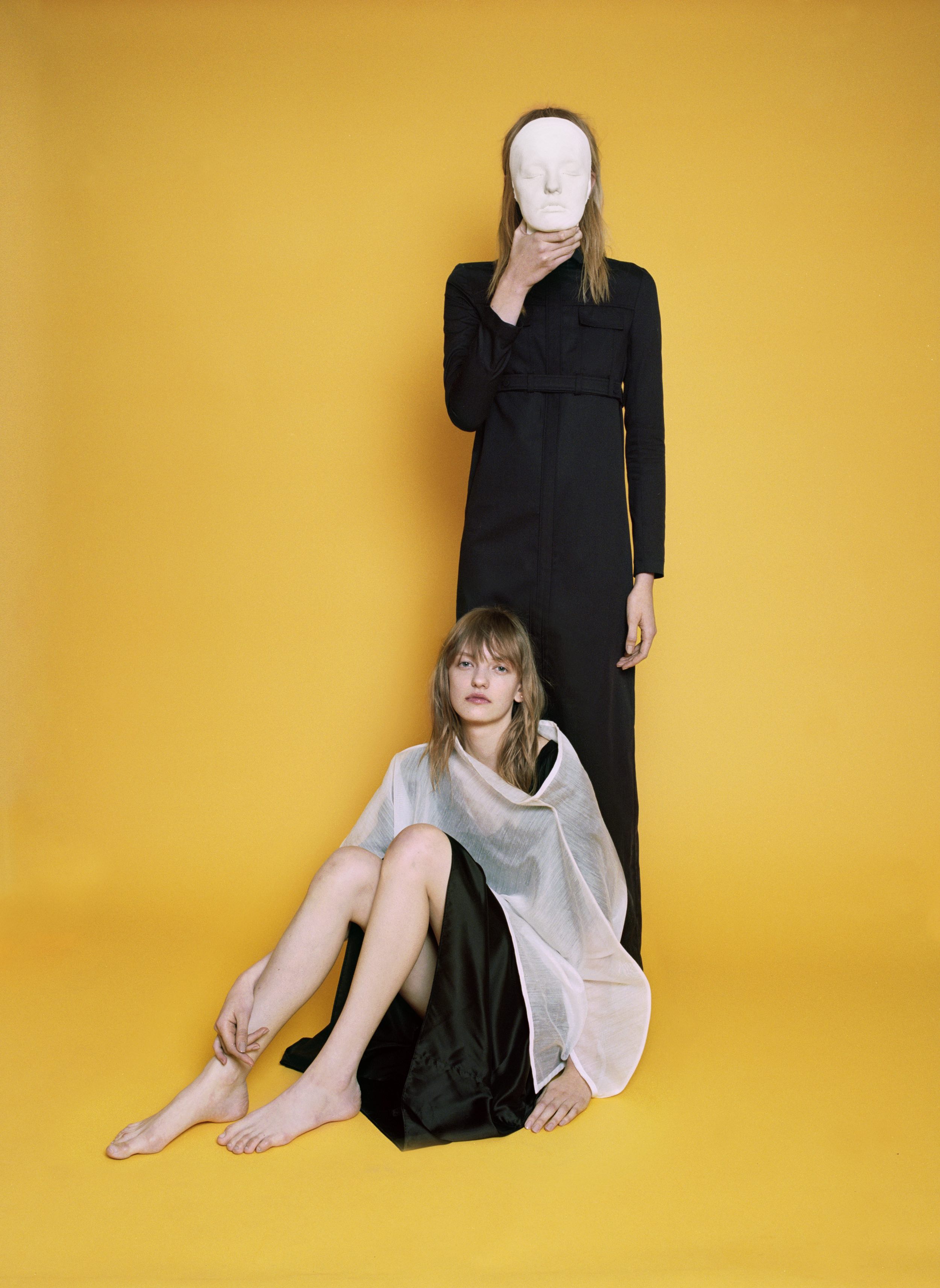 Black gabardine coat LÉA PECKRE, ramie and nylon sheer tunic ISSEY MIYAKE, black silk dress BLESS.