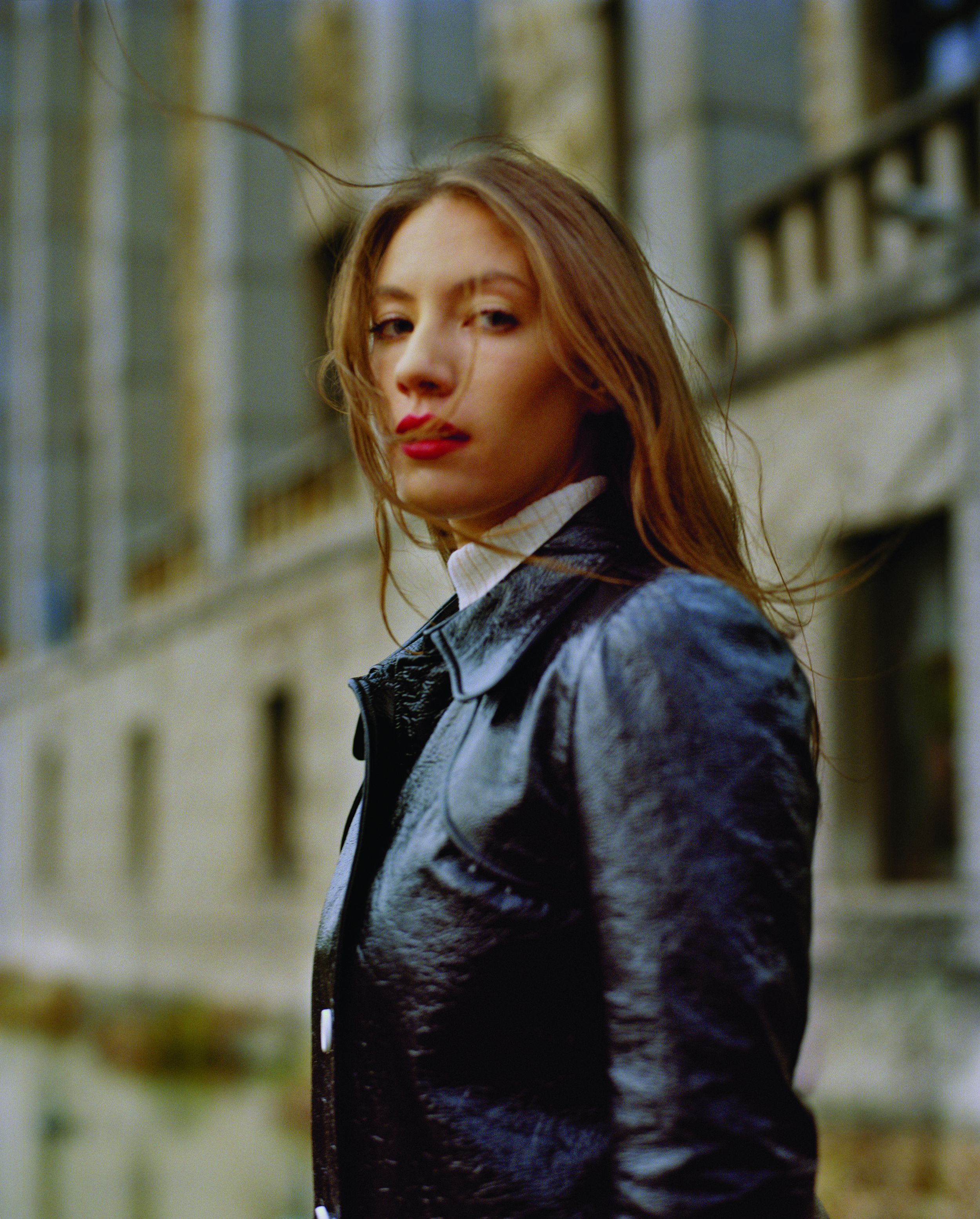  Black lambskin coat and knitted turtleneck  COURRÈGES.  