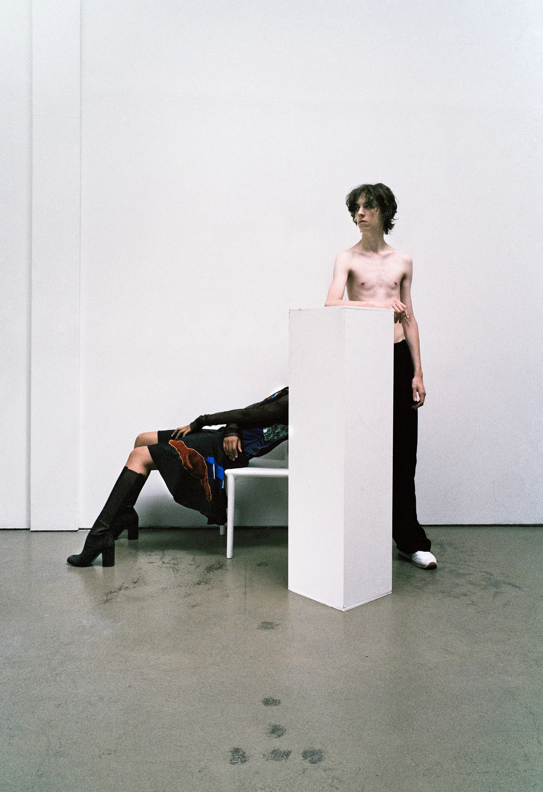 Multi printed patchwork dress, fishnet turtleneck, wide leg trousers. White sneakers REEBOK Burgundy leather boots LAURENCE DACADE 