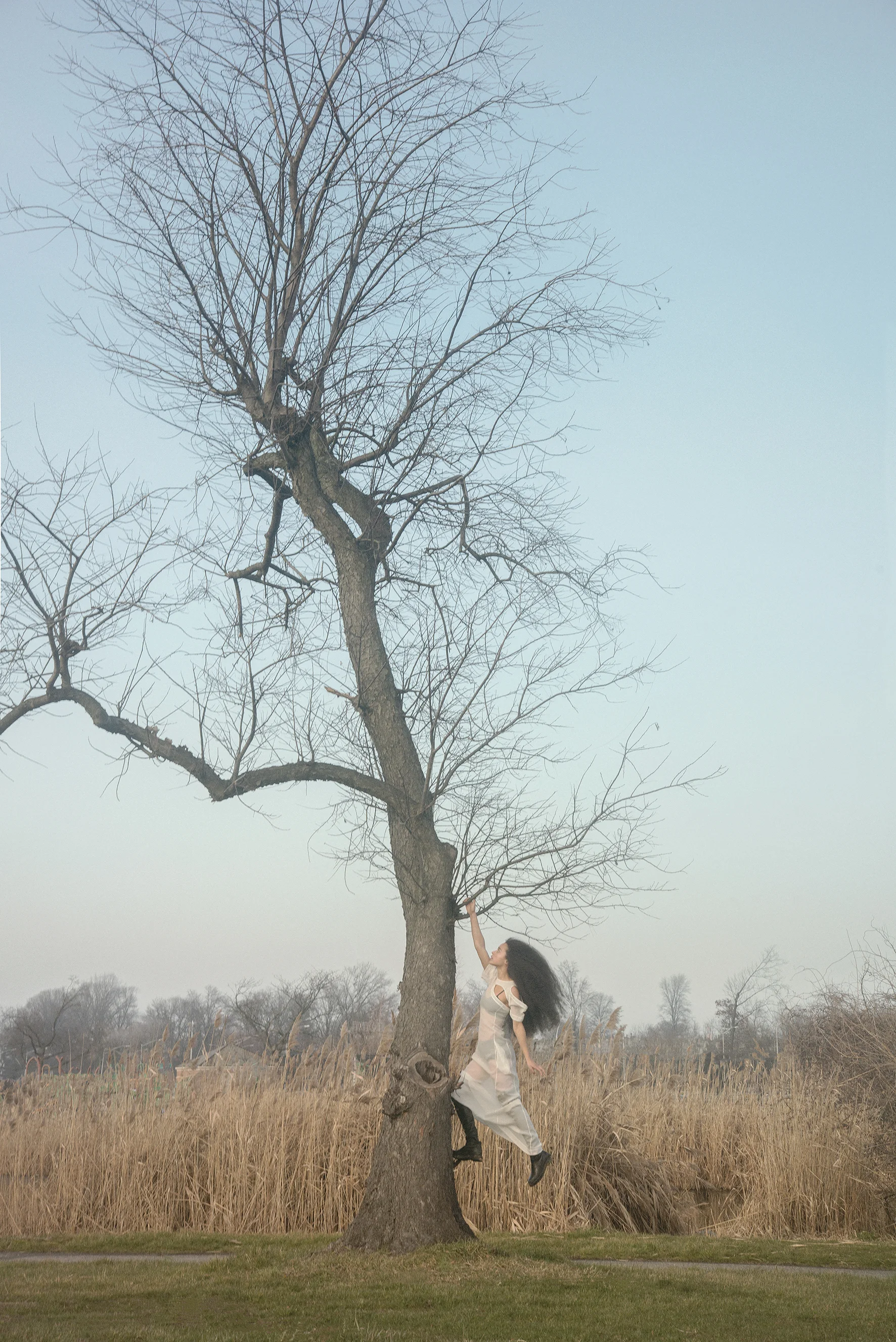 voile white dress, light voile black bra and panties and leather black country boots CÉLINE. 