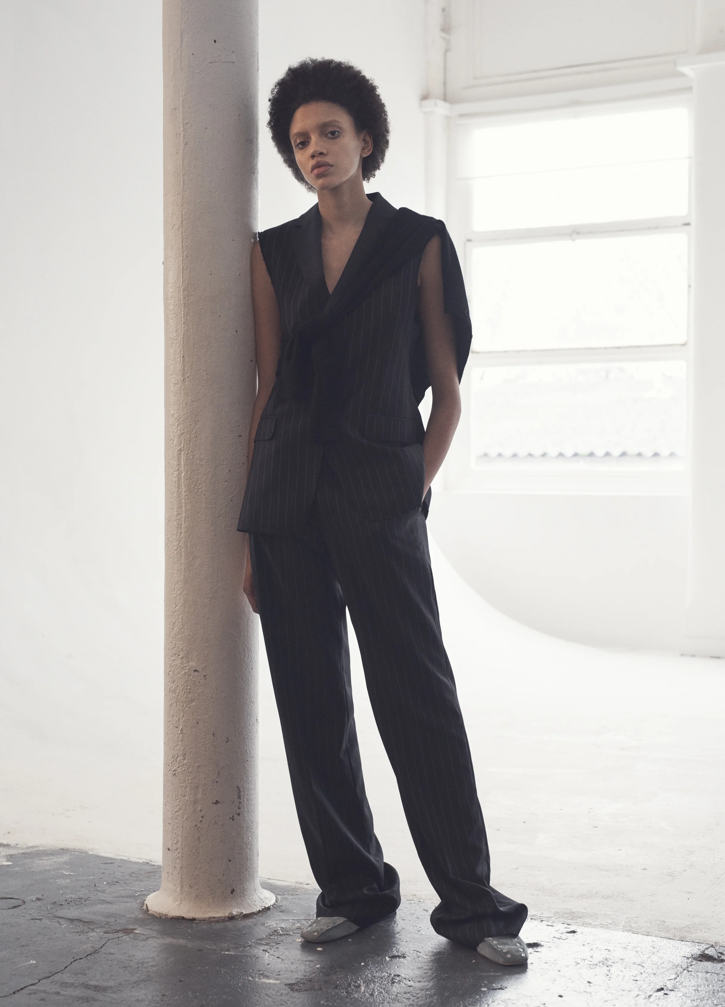 Sleveless pinstripe suit ALEXANDER MCQUEEN, suede kidskin soft studded loafer CÉLINE.