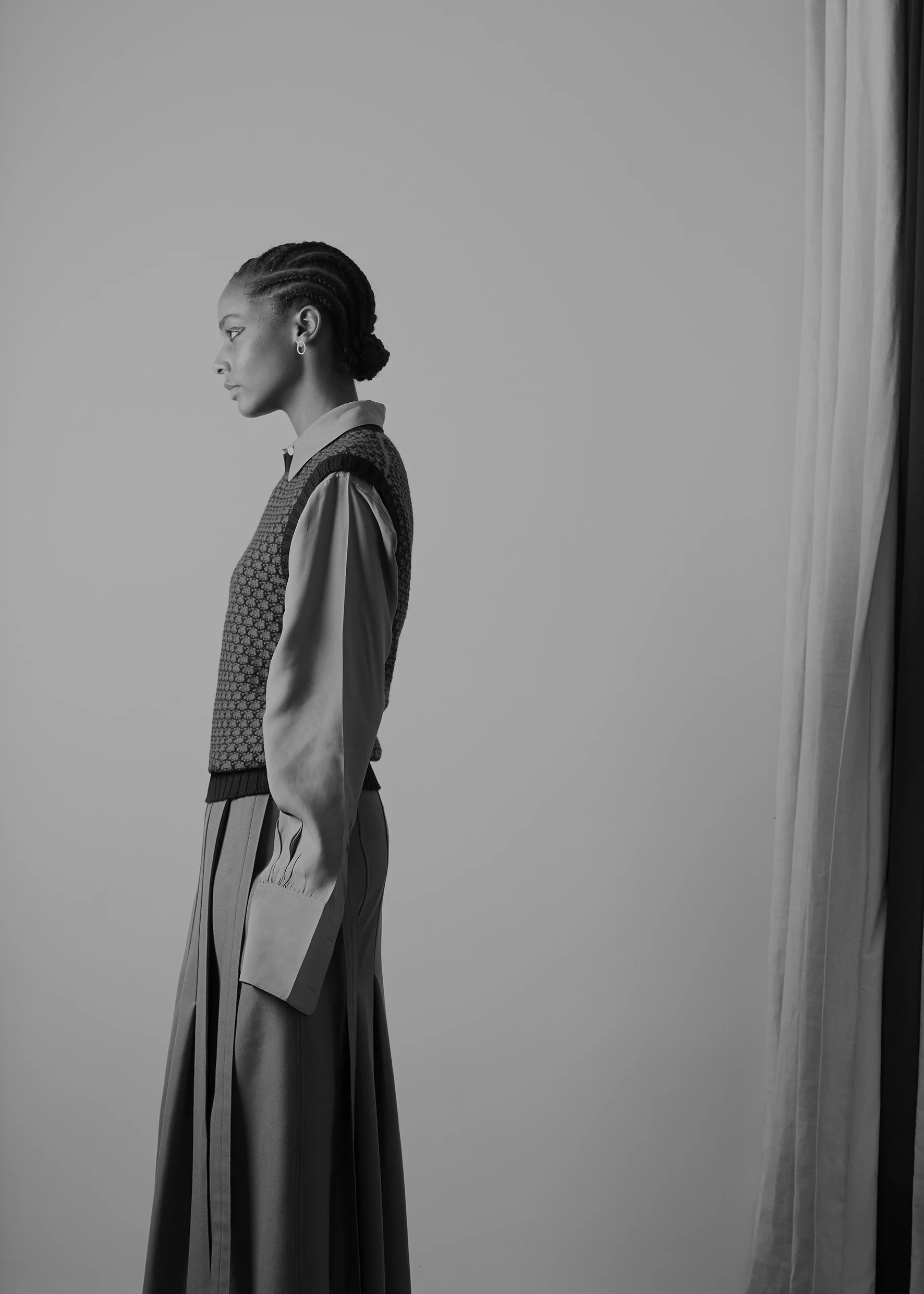 Viscose twill oversize shirt and long wrap wool blend skirt CÉLINE, honeycomb sleeveless jumper HOLLAND & HOLLAND, golden earring COMPLETEDWORKS.