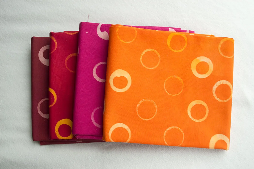 Warm bundle features shades of orange, red, pomegranate, and fuchsia.
