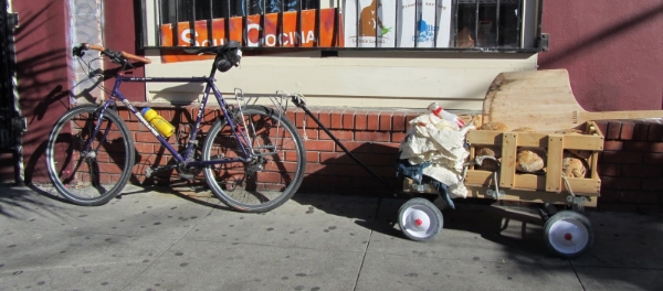 this is how i used to get my bread around town. and not just my bread - as you can see from the pile of stuff, i would also bring all of my bread making supplies with me. a bit of a gypsy baker if you will.