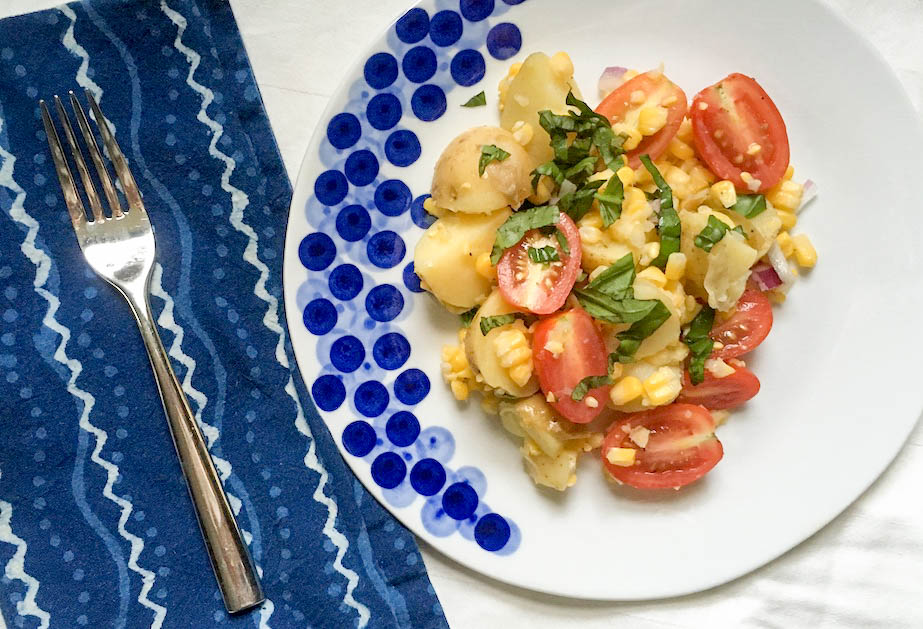INGREDIENTS 2 pounds small potatoes, such as Yukon Gold 1 pound cherry tomatoes 4 ears corn 1 cup basil leaves Salt and pepper DRESSING 1 shallot or 1 quarter red onion 1/4 cup neutral oil such as sunflower or Canola 1/4 cup white wine vinegar PREPARATION Boil potatoes, cool and cut into 1/2 inch pieces. Boil corn and cut off cob. Slice cherry tomatoes in half. Combine in a large bowl. Chiffonade basil and add to salad. Make dressing - mince shallot or onion, combine with oil and vinegar. Pour over salad and toss. Season with salt and pepper to taste.