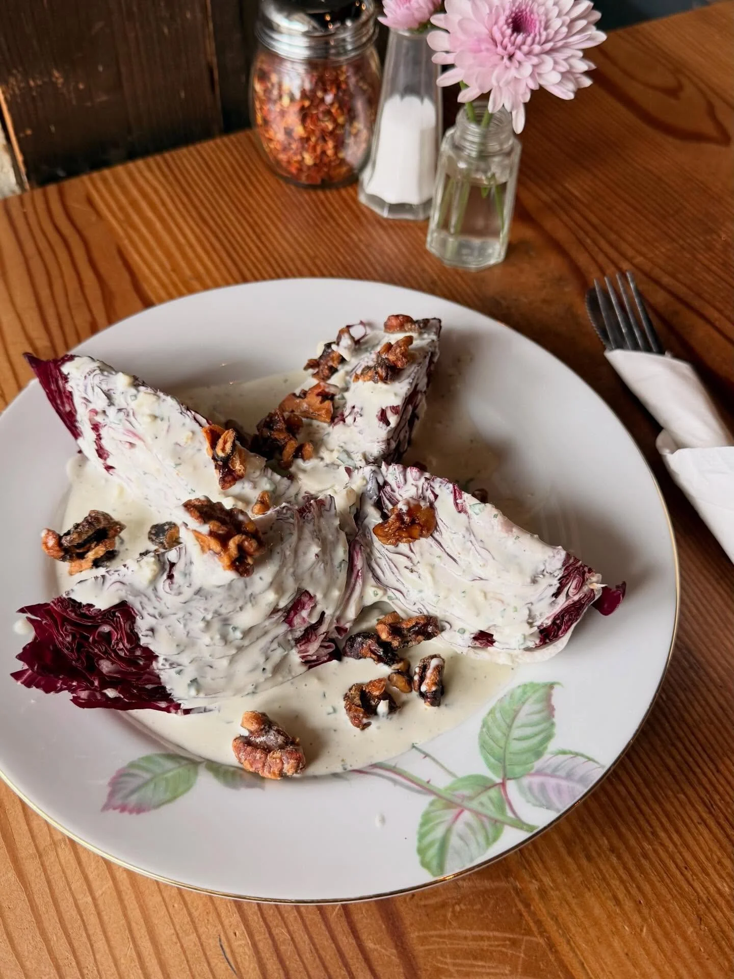 our Winter Wedge salad, with crisp, bitter radicchio topped with a Rogue Creamery smoky blue cheese dressing and candied walnuts ✨