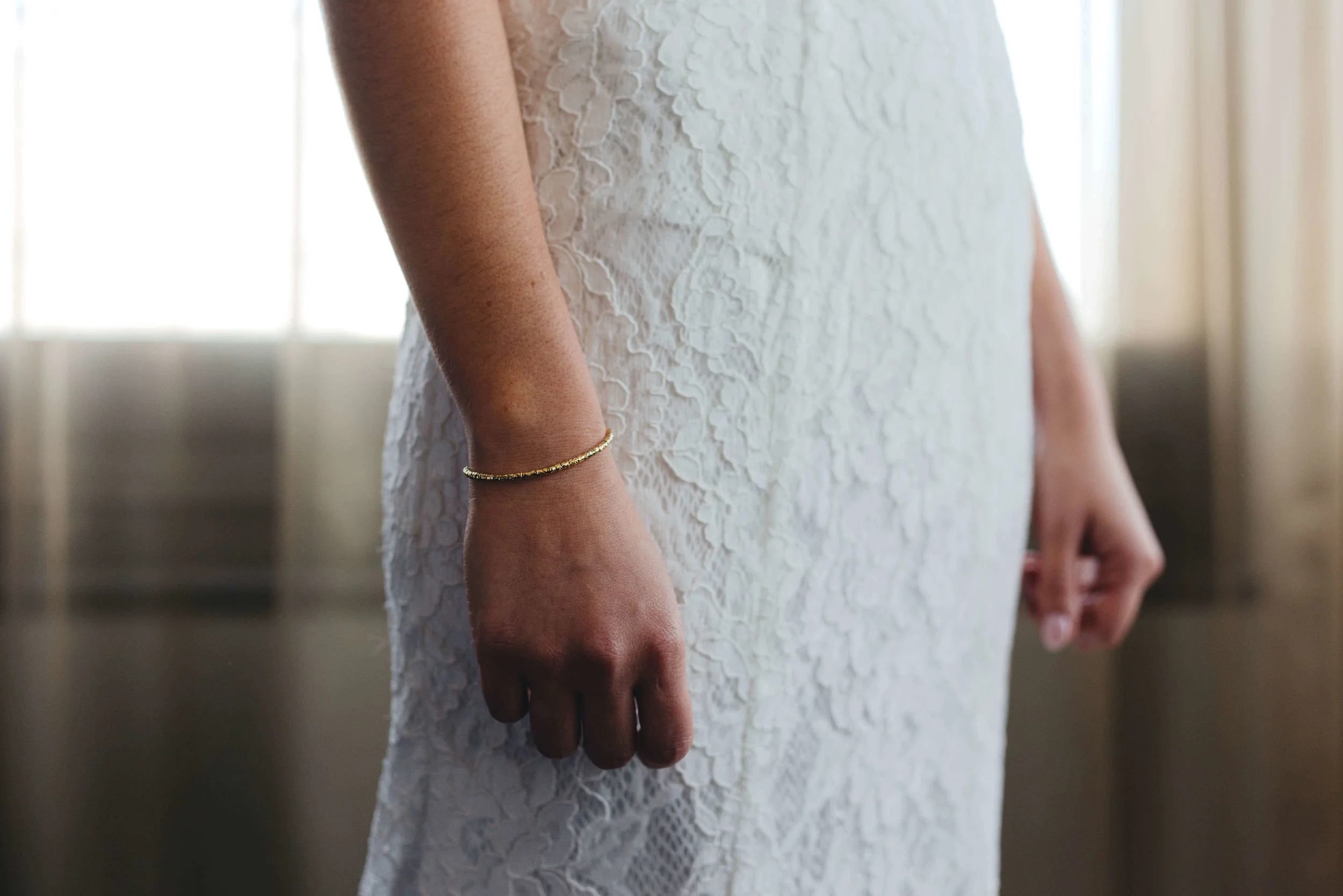 Roy Son Photography | Raspberry Island and Octo Fish bar | Minneapolis wedding planner Sixpence Events | lace bridal dress simple with simple gold bracelet