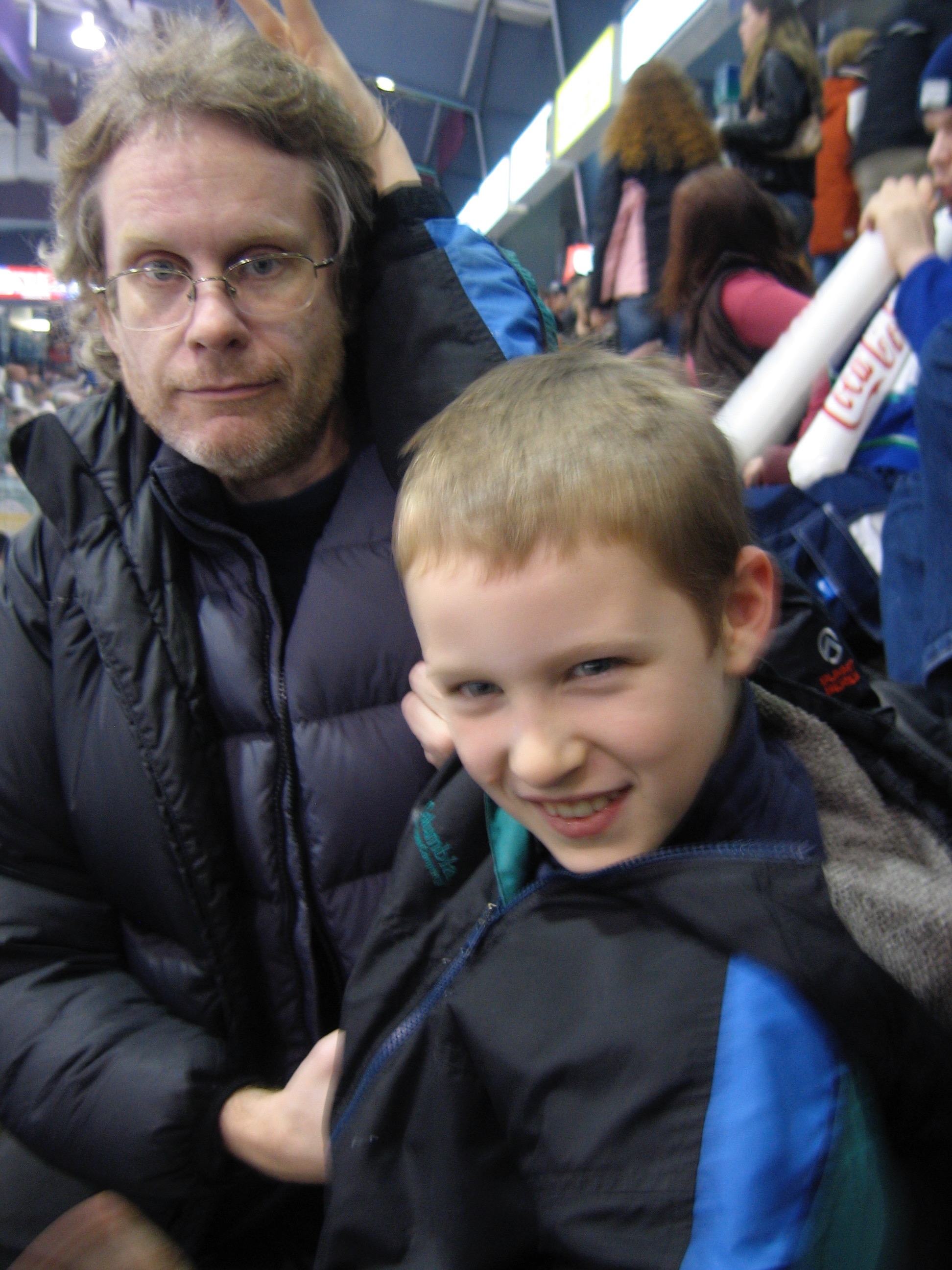 At a hockey game in Victoria with Clark's son Daniel.