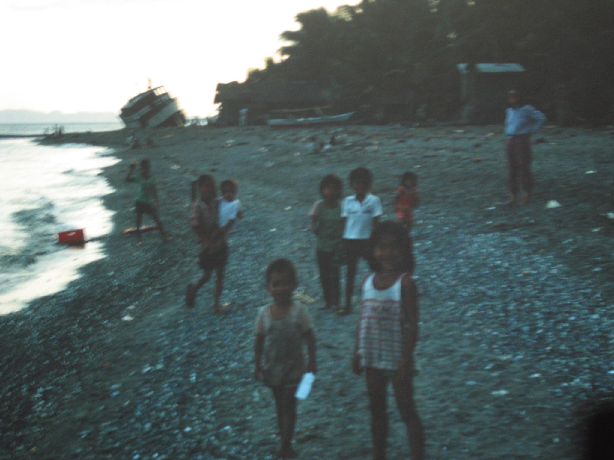 Filipino kids on a beach, perhaps in Puerto Galera, I'm not sure (we went to alot of islands — some of them economically grim, all of them beautiful).