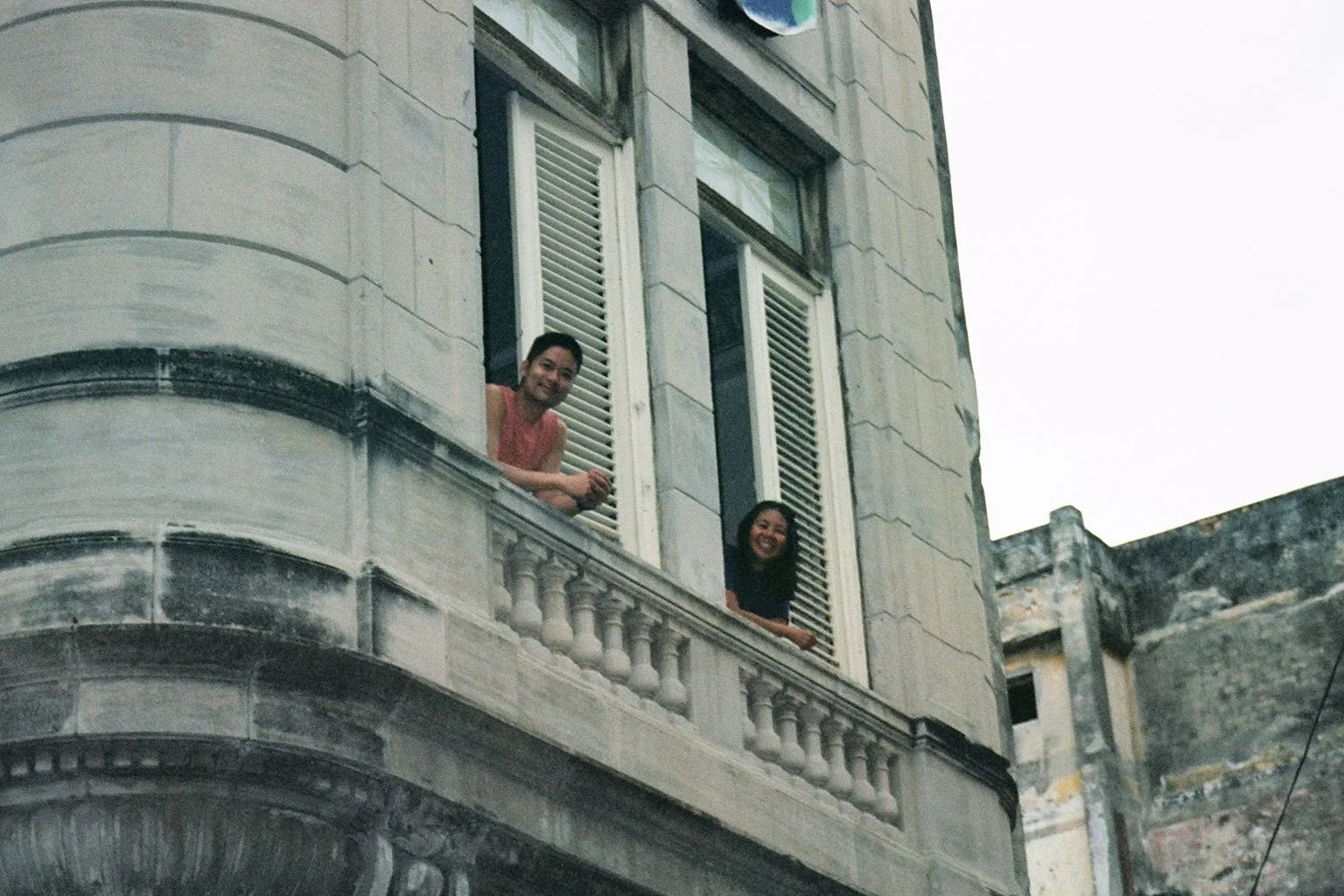 Greg and Ruby leaning out of our Havana casa, 2004.
