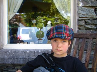 Above: Nephew Max with dapper Scottish hat. Right: Max being strangled by sister, at Heritage Park, Calgary.