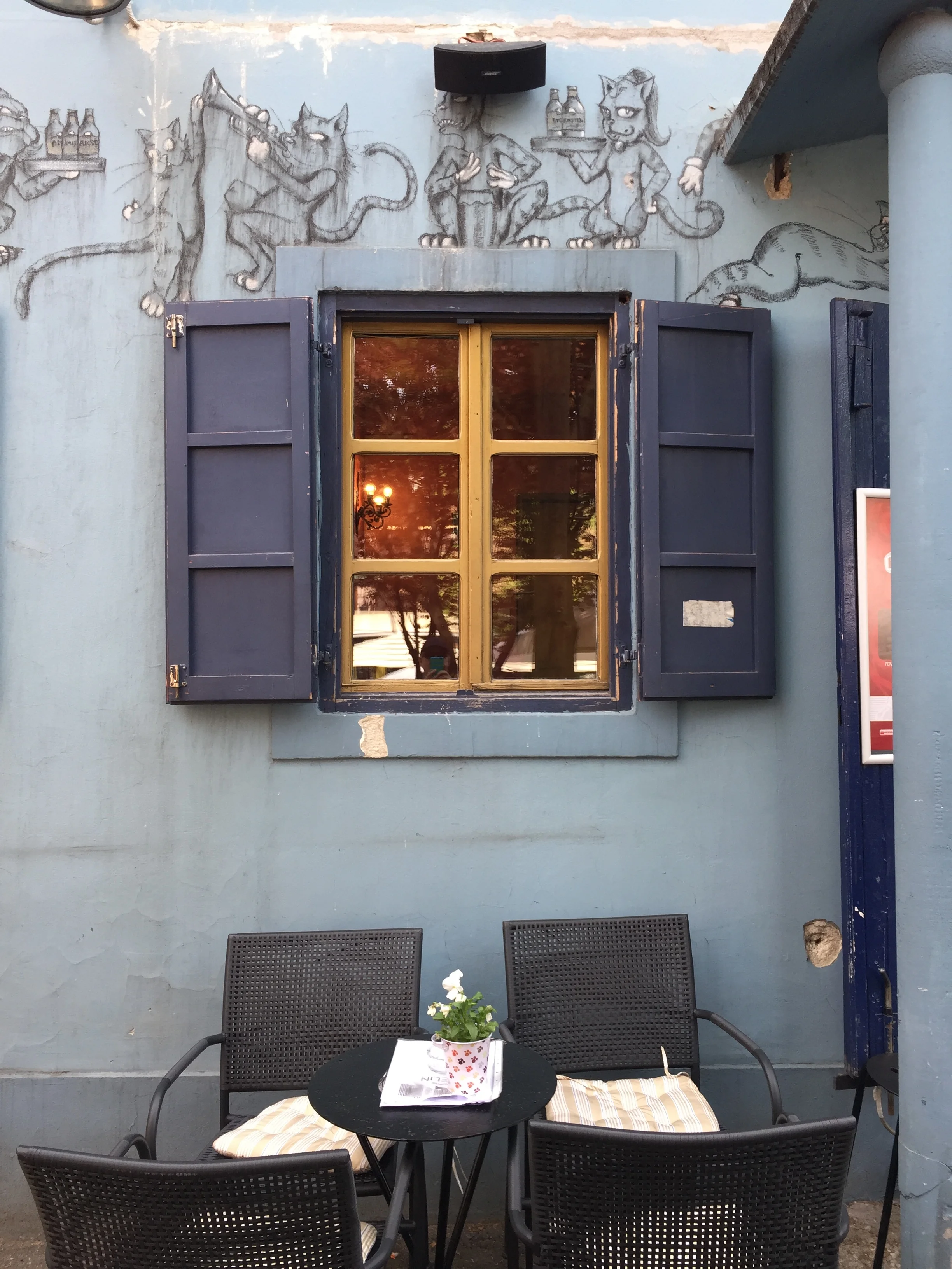 A blue cafe with cats — it reminded me of Bulgakov's Master & Margarita ...