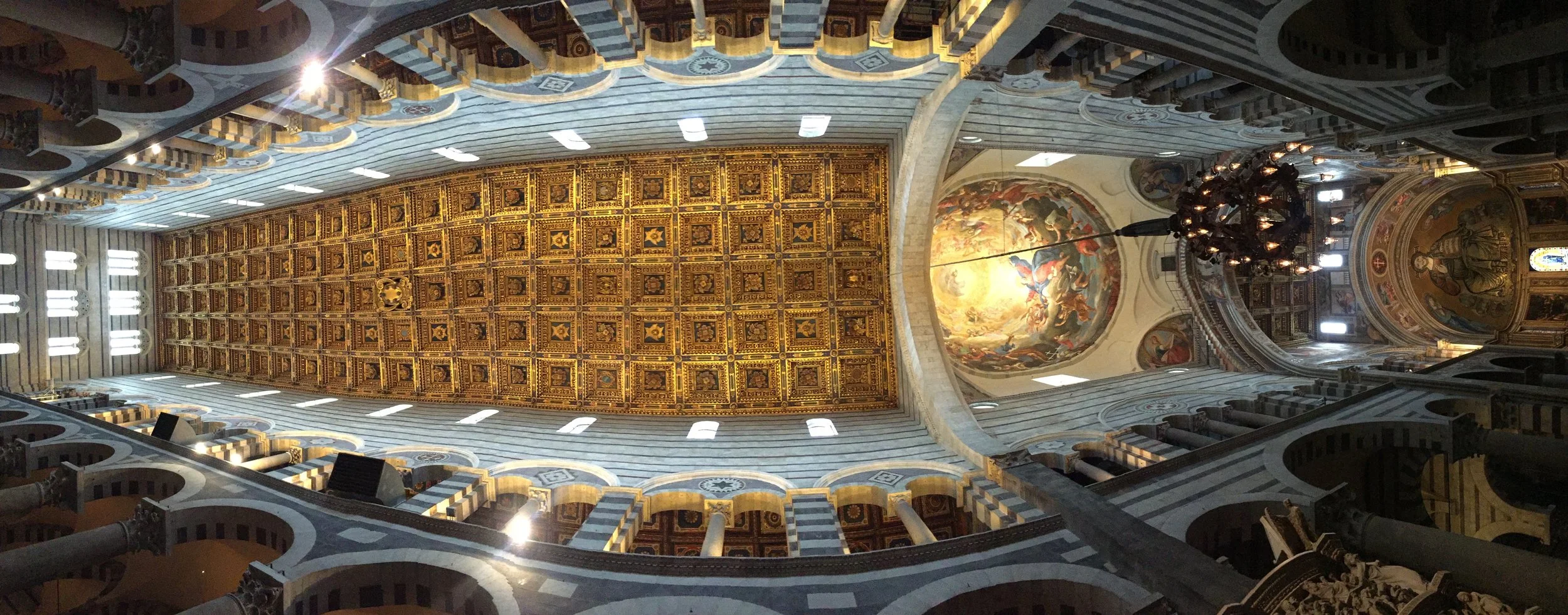 From Wikipedia: “The lamp at the center of the nave is called Galileo's lamp, because a legend says that the great scientist formulated his theory of isochronism of the pendulum while watching its oscillations from the roof of the nave. The original, however, smaller and very different than this one, is found today in the Camposanto.” Still, the lamp in the Cathedral makes one think about religion, astronomy, and the history of human knowledge.
