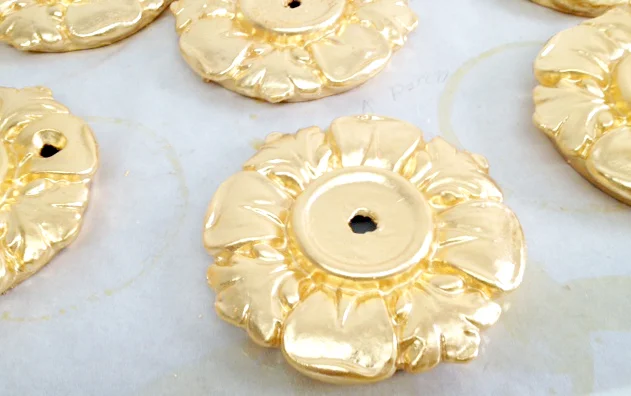  23.75k oil gilded rosettes for building exterior, NYC 