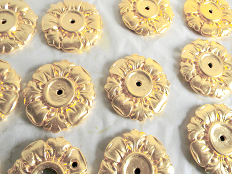 23.75k oil gilded rosettes for building exterior, NYC