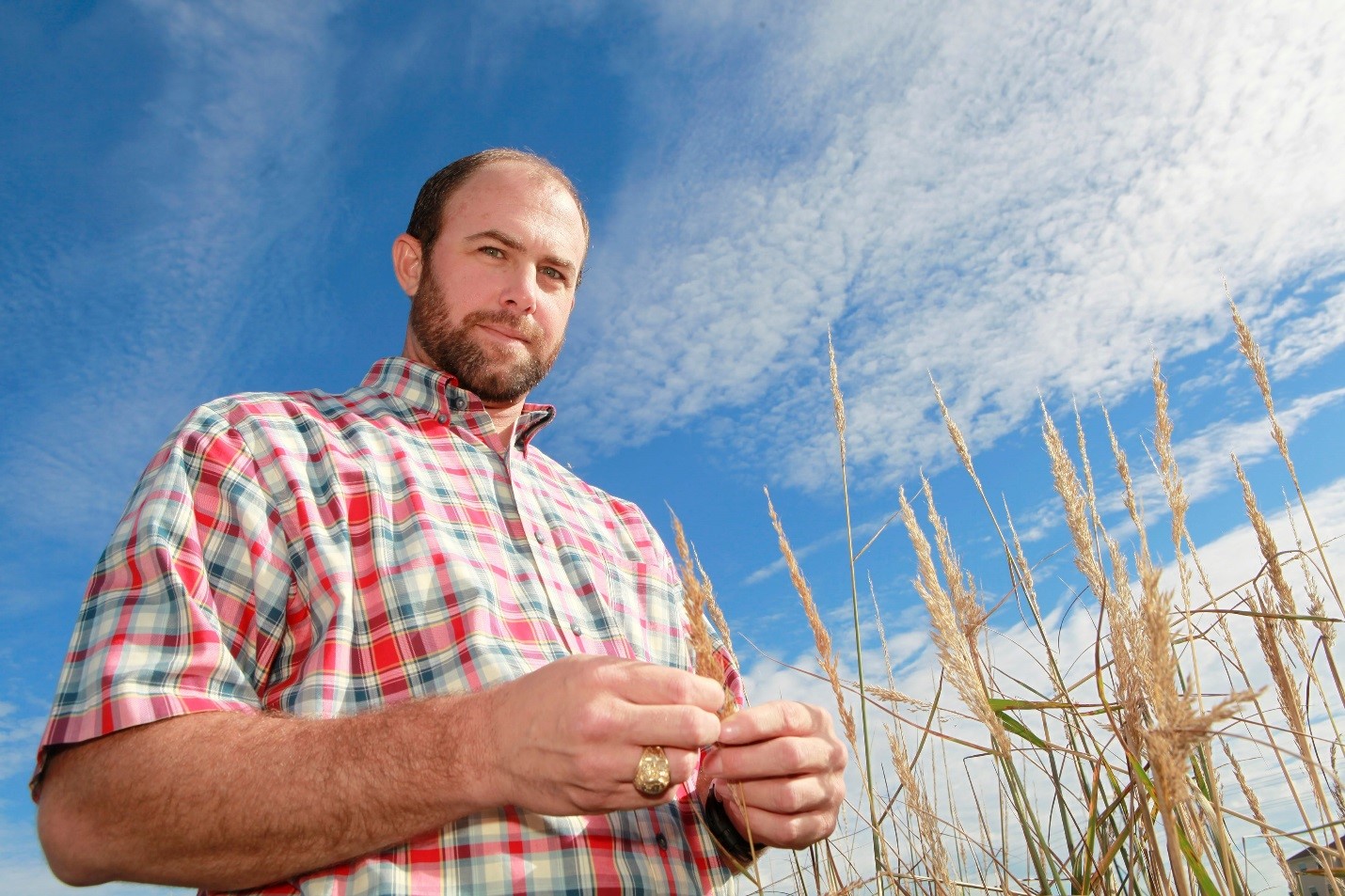 Forrest Smith examining native plant trials.