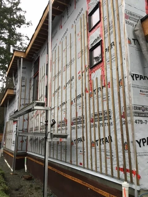 The West wall prepared for window trimming and siding. Note the new scaffolding system - very cool.
