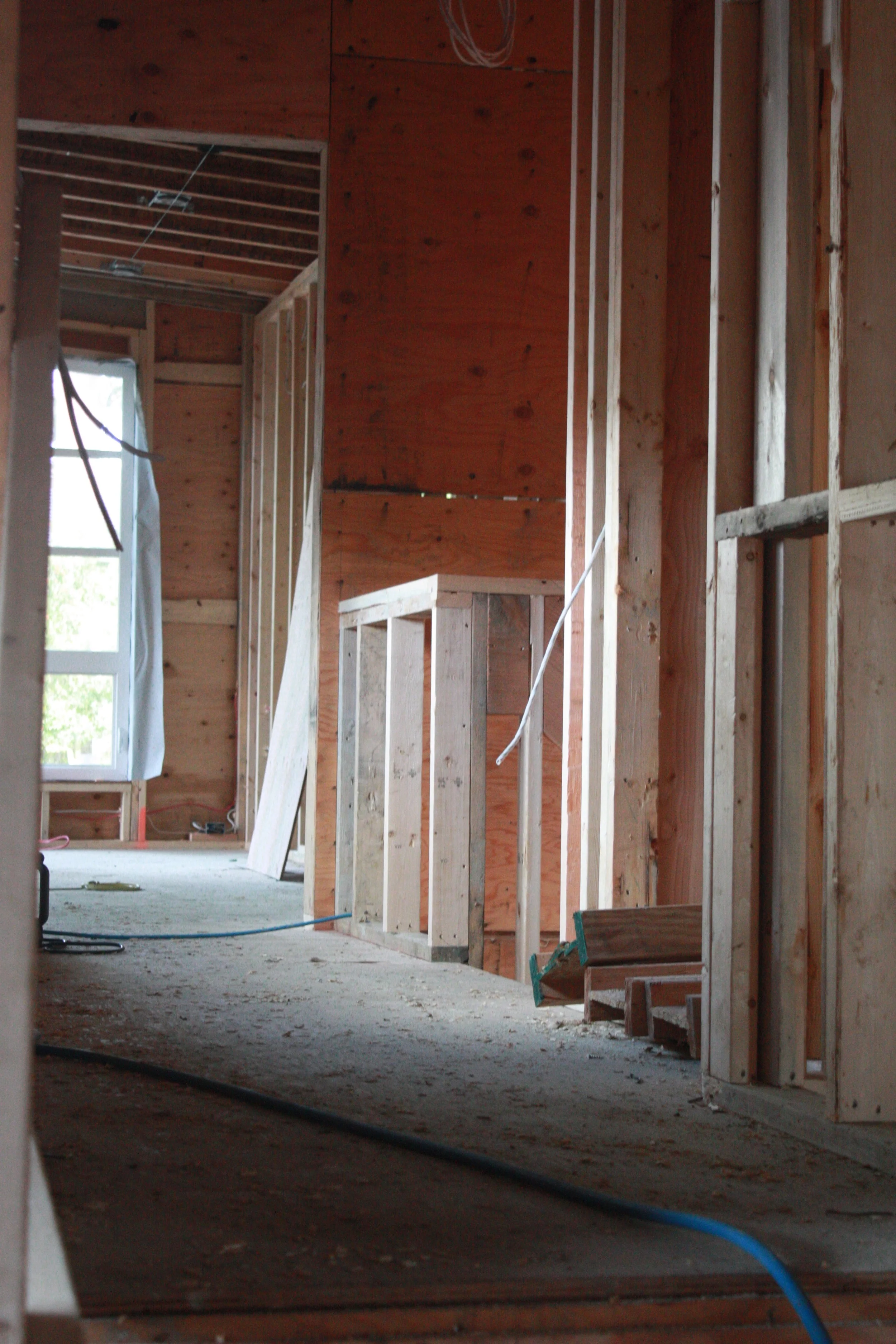 Top of the stairs with a view into the bedrooms above the garage.