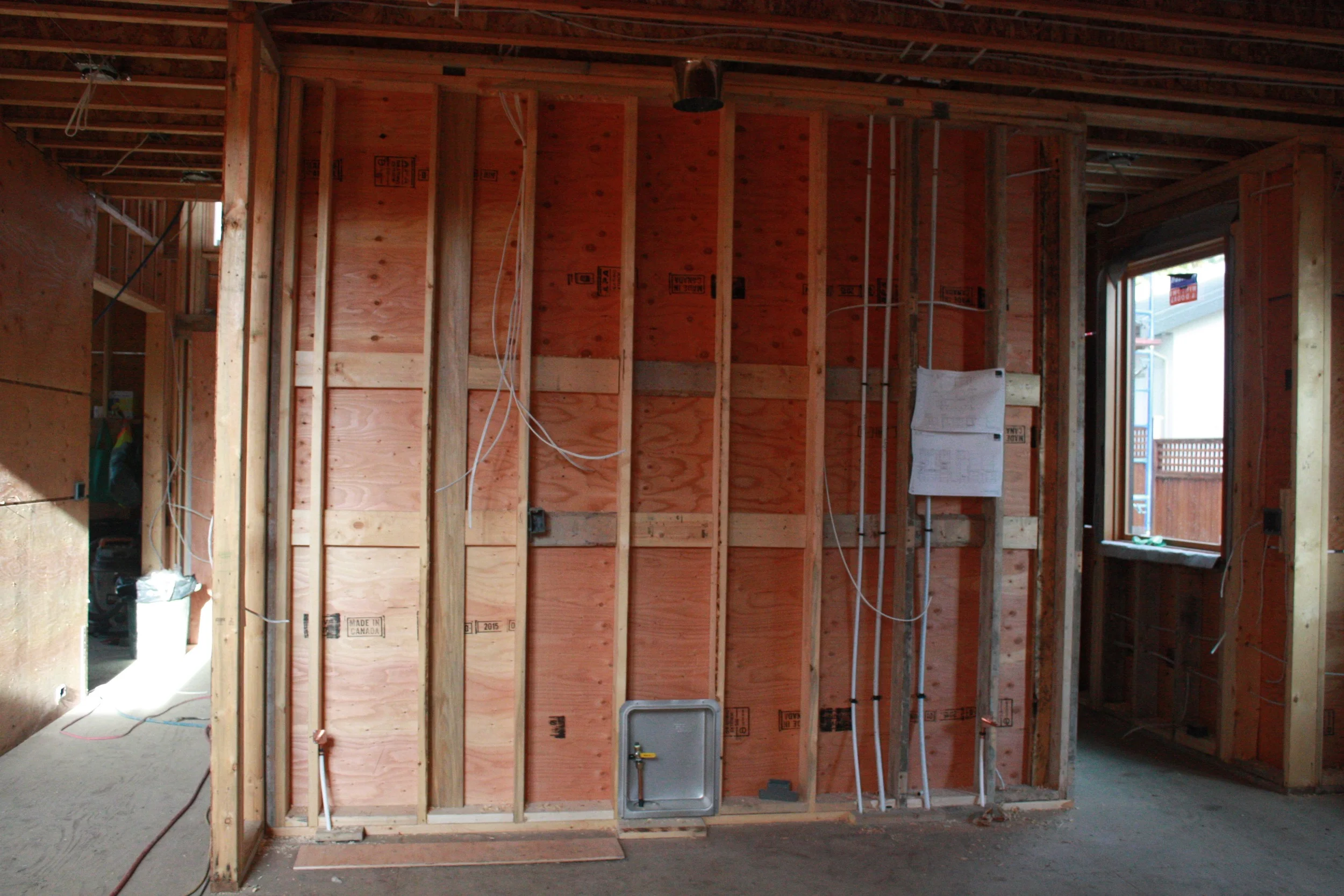 Kitchen wall, with appliance plumbing, electrical and gas fittings. 