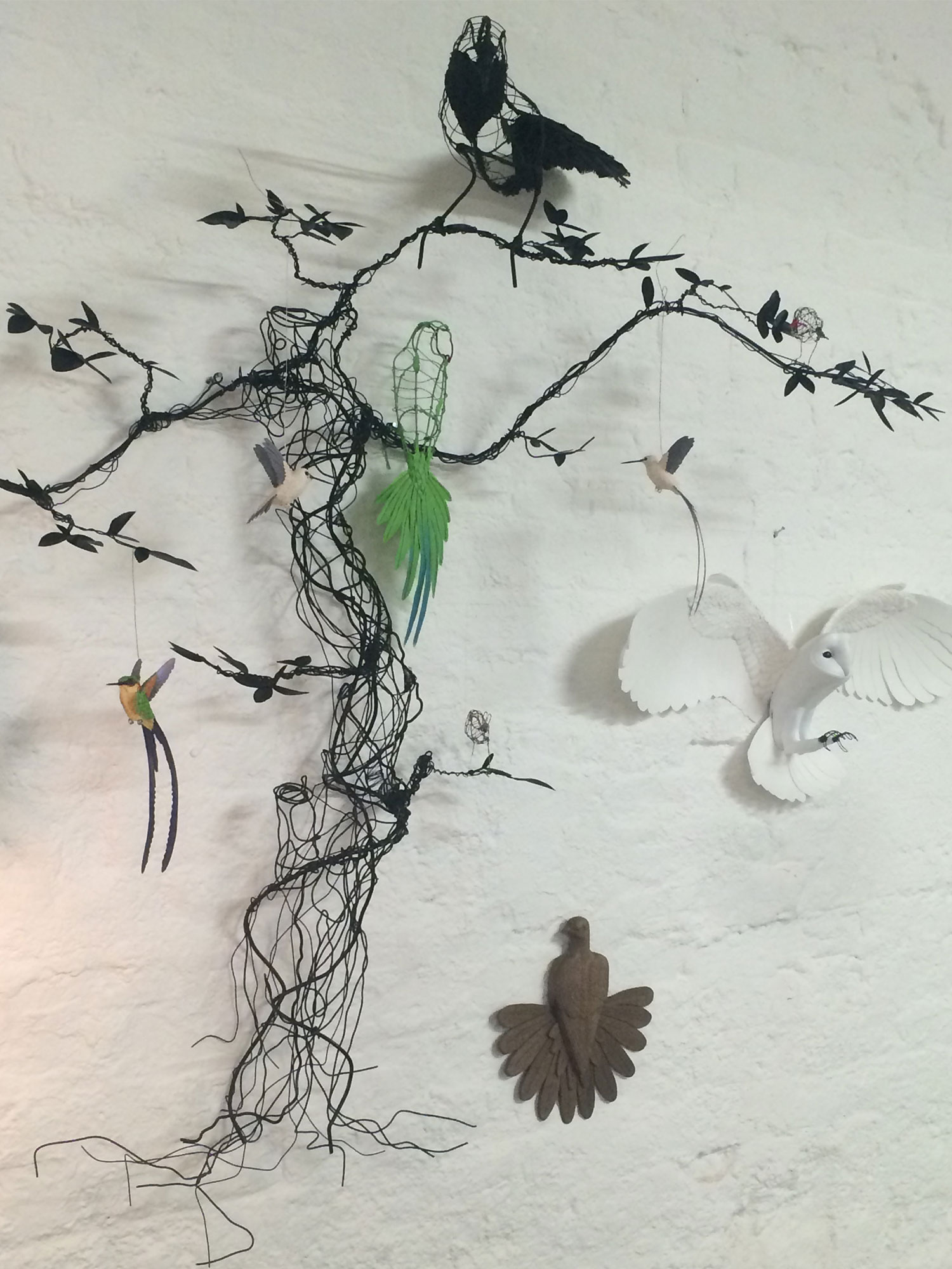 These amazing birds are made from Wood and paper by Zack Mclaughlin