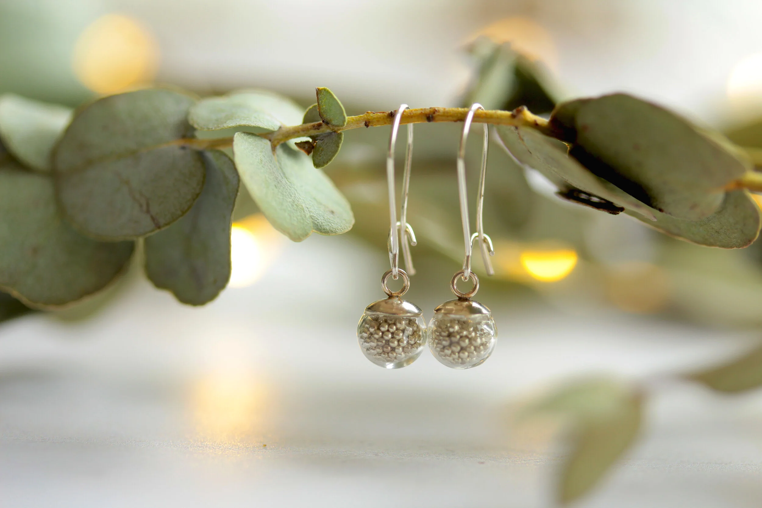 Kinetic Sterling Silver Tiny Drop Earrings filled with Silver Micro Ball Bearing Beads by Lizzy Chambers