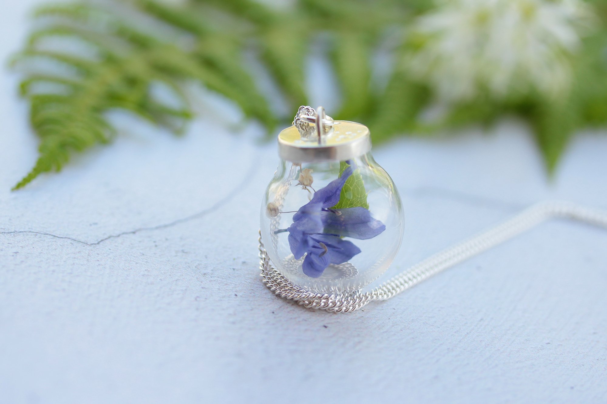 Lizzy Chambers Medium Bluebell with custom silver top in hand.jpg