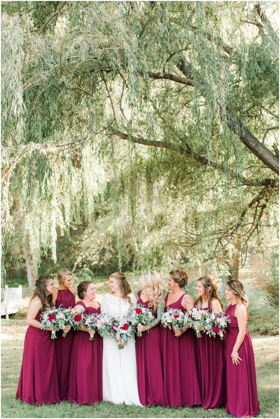 Our willow trees, and bridge in the background, perfectly compliment this bridal party shot.