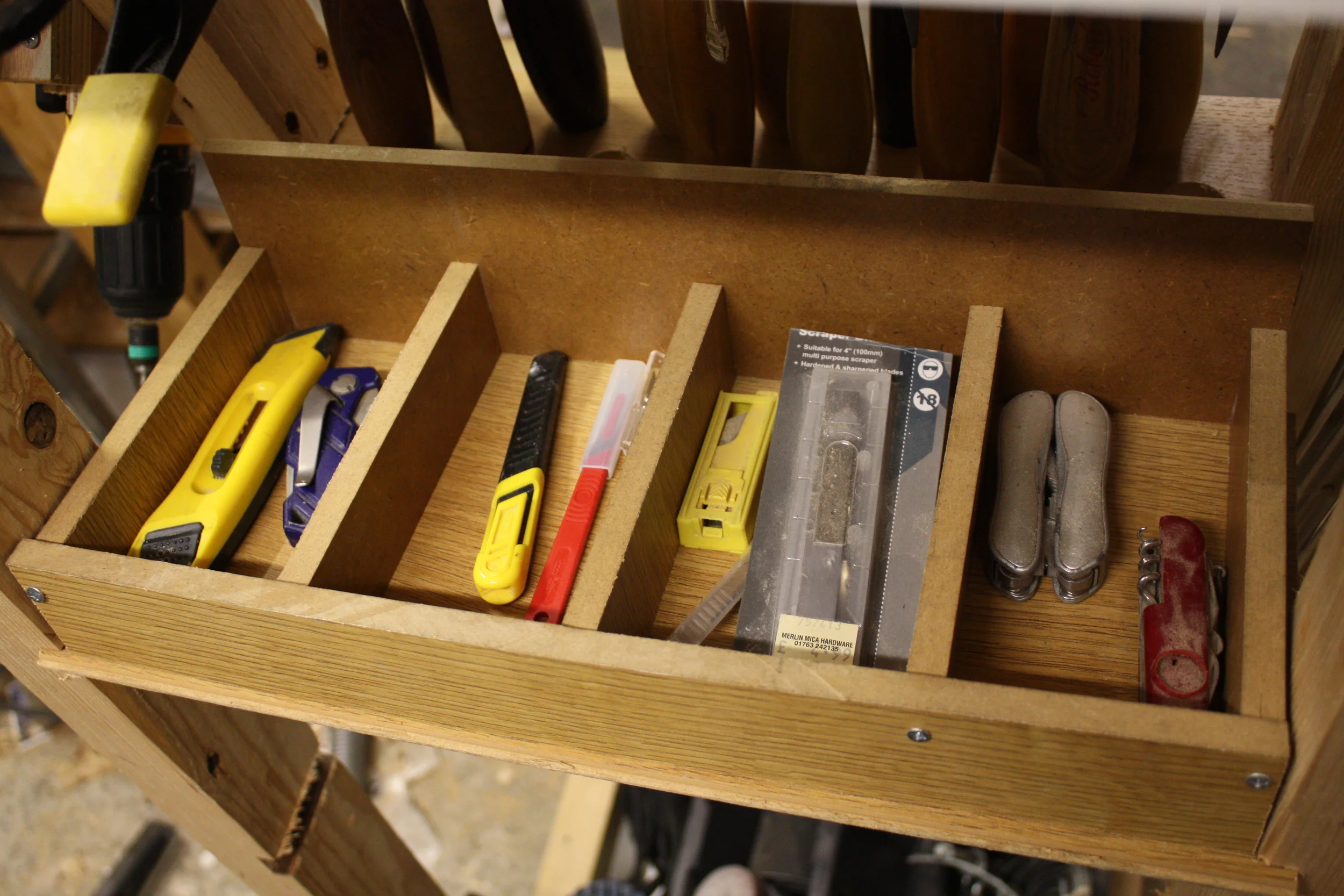 Rear storage for box cutters/craft knives, multi tools etc