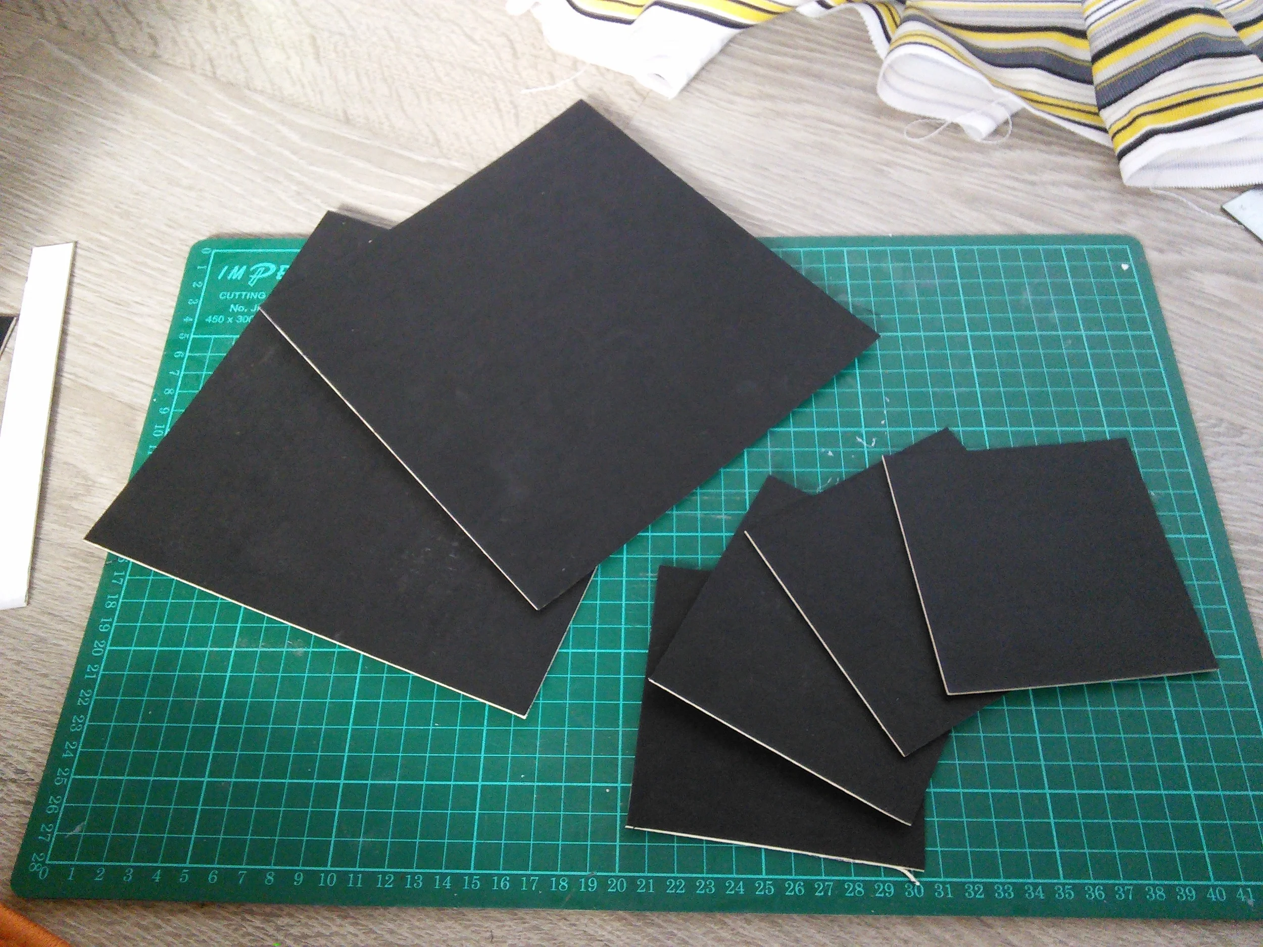 The colour of the mountboard is unimportant as it will be completely covered by fabric. However, I discovered that the dye in this dark card had a tendency to come off when the glue was applied. Not enough to be a problem, but enough for me to recommend using a light coloured card as your core.