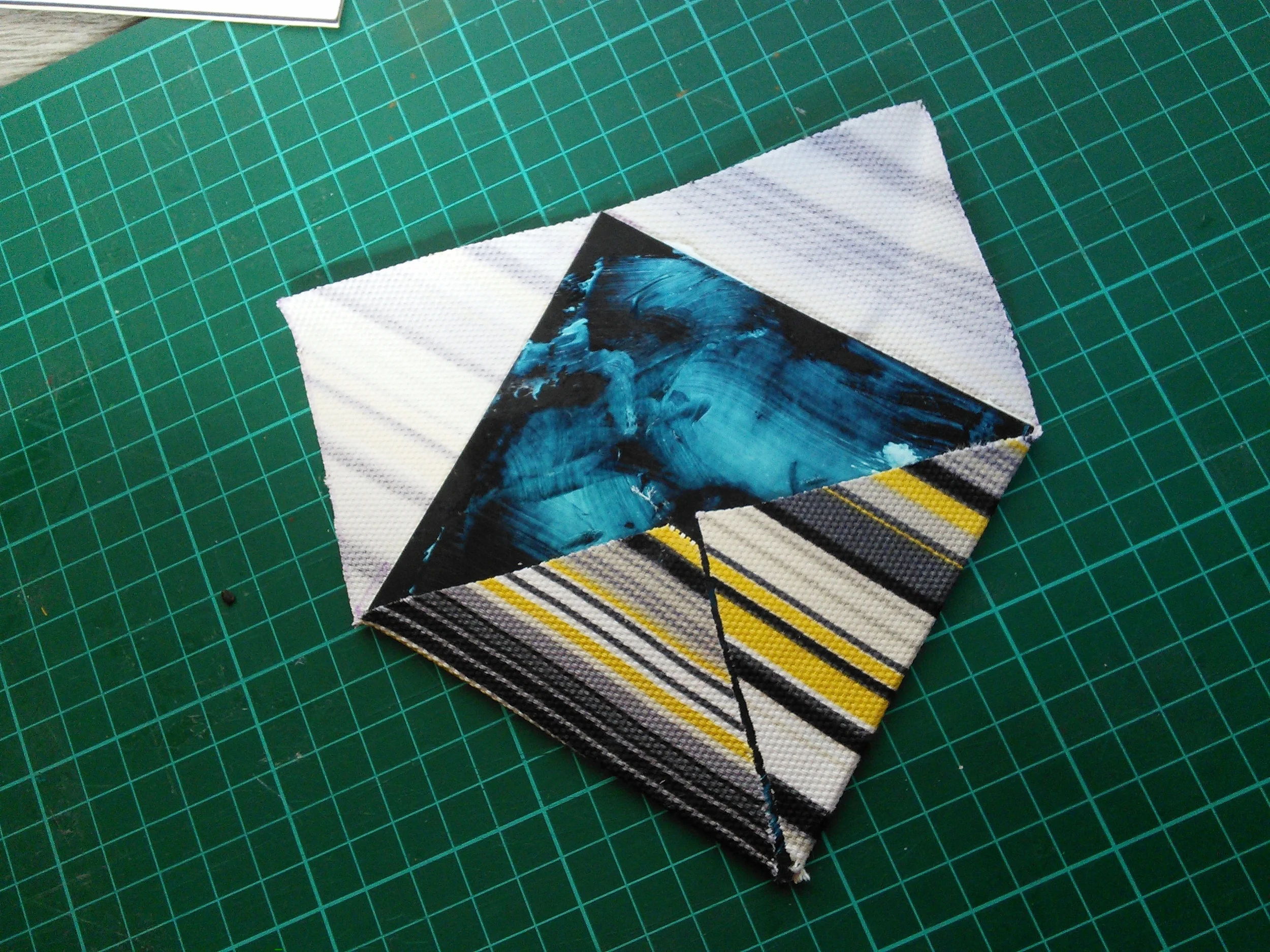 If there's overlap between the edges of the fabric when it's folded over you can cut this away with the craft knife. Removing the overlap ensures that the coaster, and by extension your glass of wine, doesn't tilt.