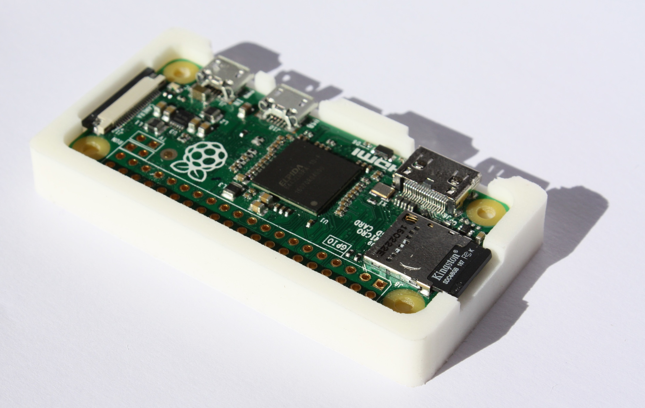 Pi Zero sitting snugly in a custom cast case.