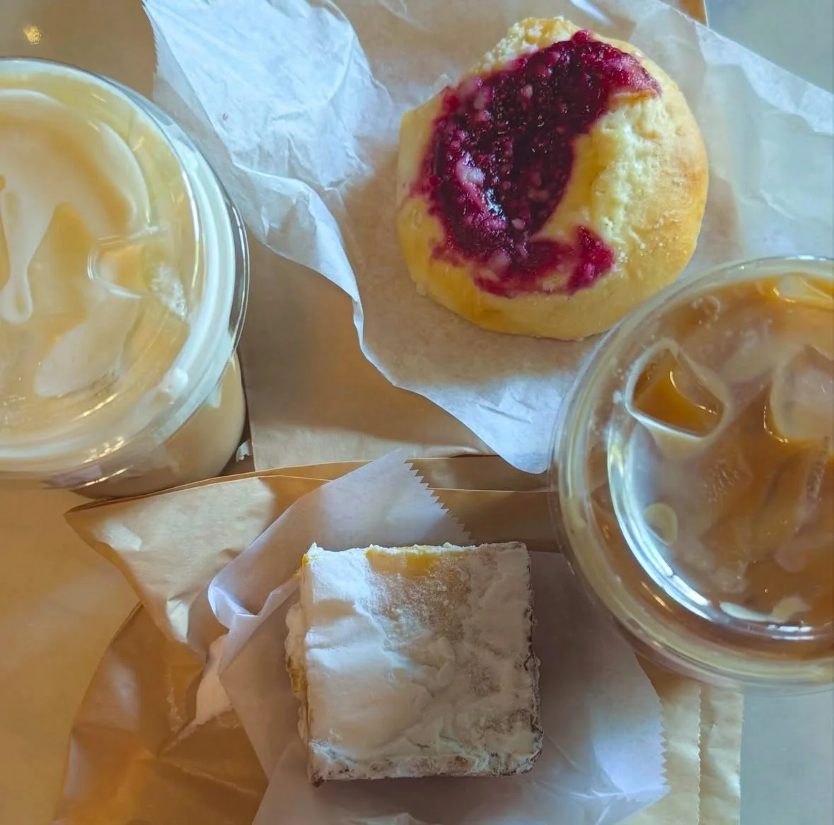 Thanks to @olsonclairee for tagging us and sharing this perfect pairing: iced lattes, fresh pastries, and a slower moment to enjoy them. Our pastry case and iced latte menu are working overtime this season, and we're not mad about it.

Swing by and s