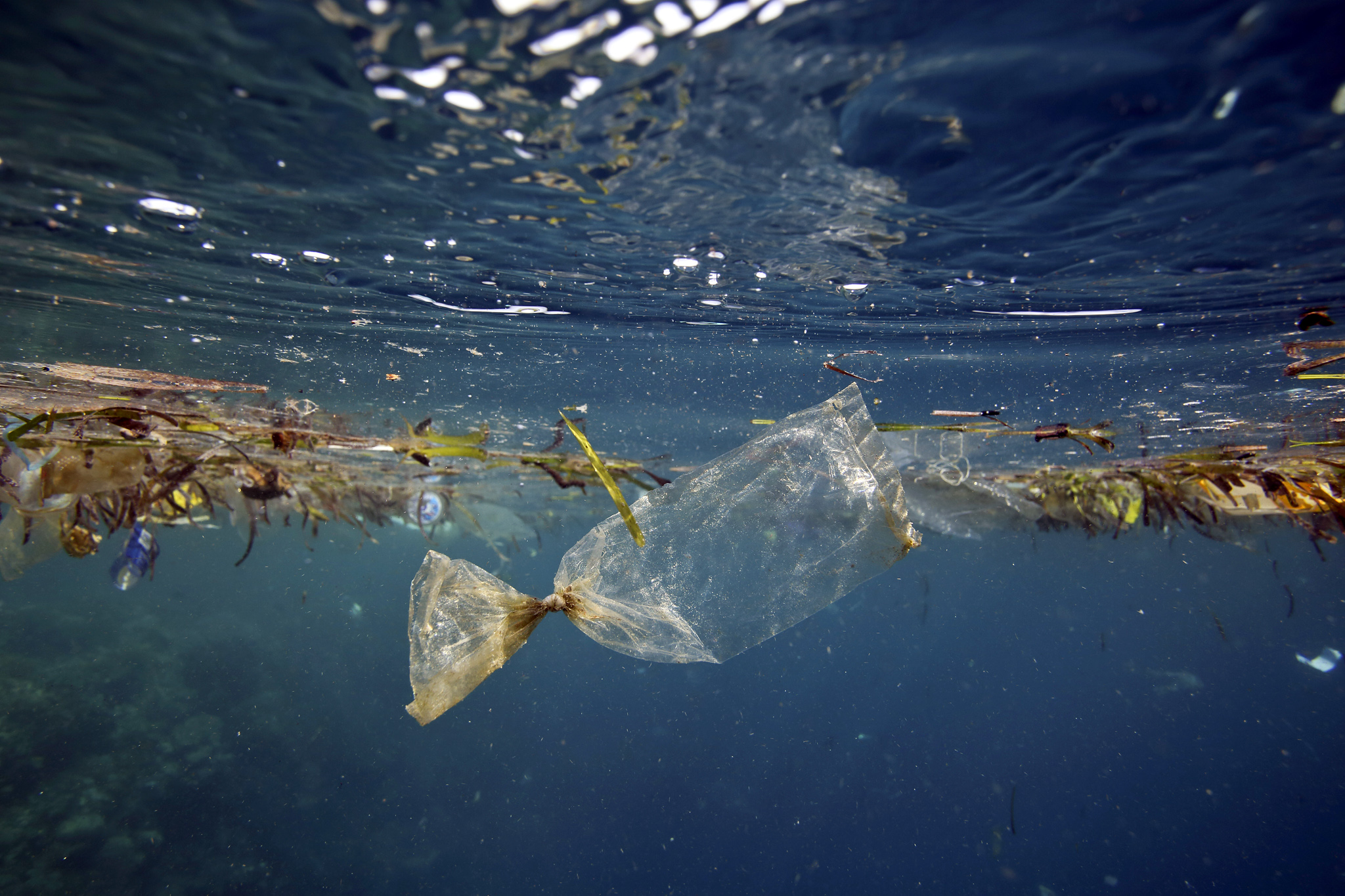 Tiny pellets of plastic form as bottles and other objects break down. Photo: Alamy