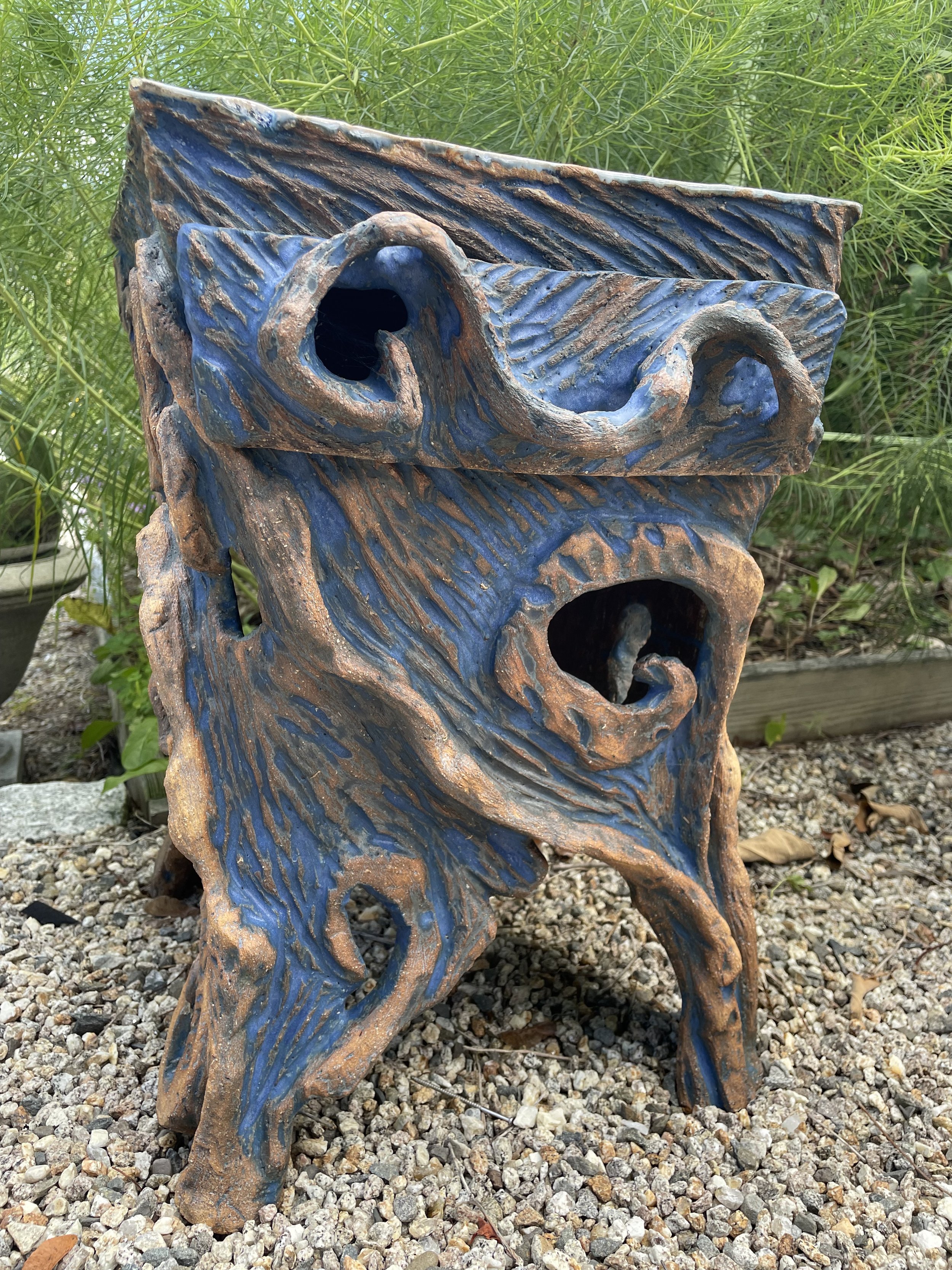 Carved ceramic table with drawer.