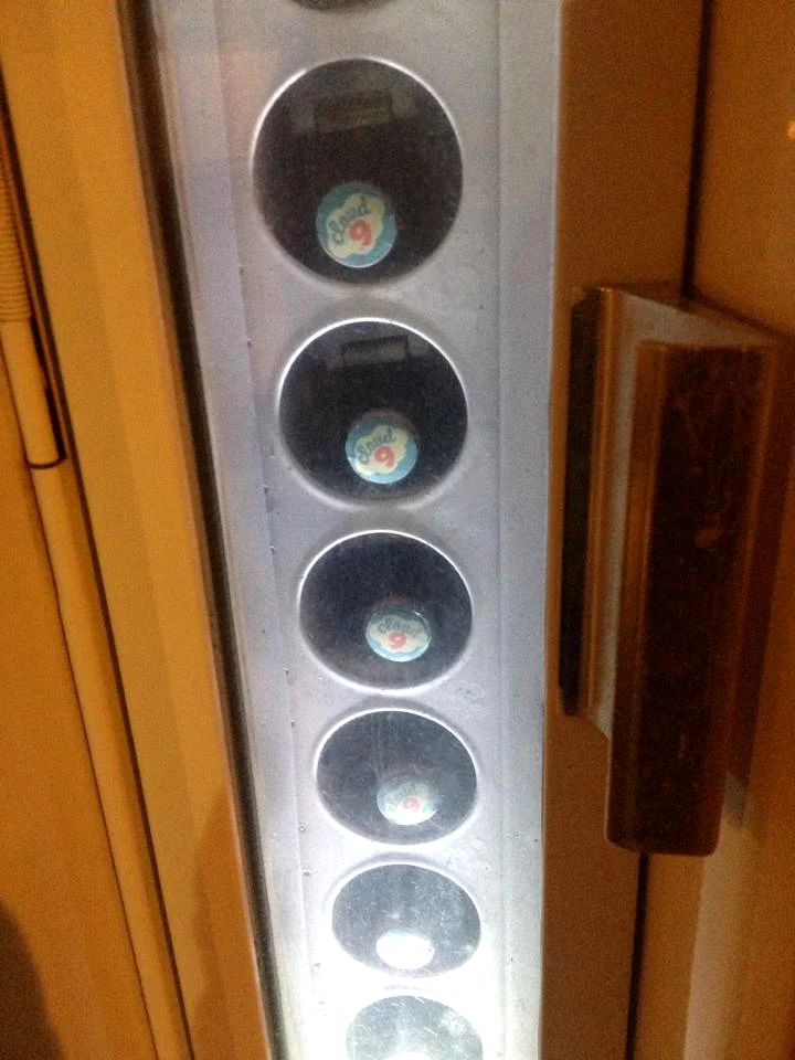 Capped bottles in vending machine.