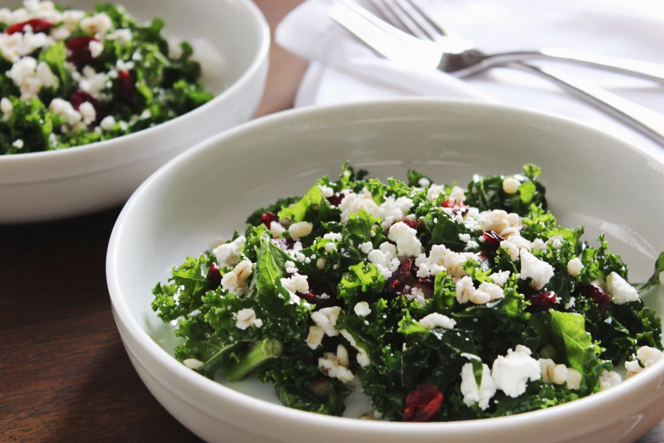 Kale salad with barley, cranberries, and goat cheese