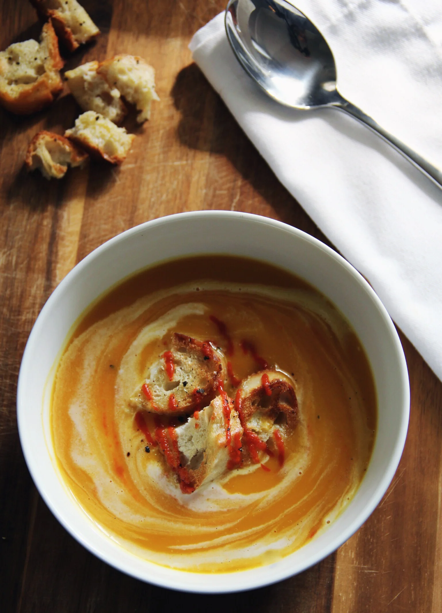 Spicy butternut squash soup with coconut milk and peppered croutons