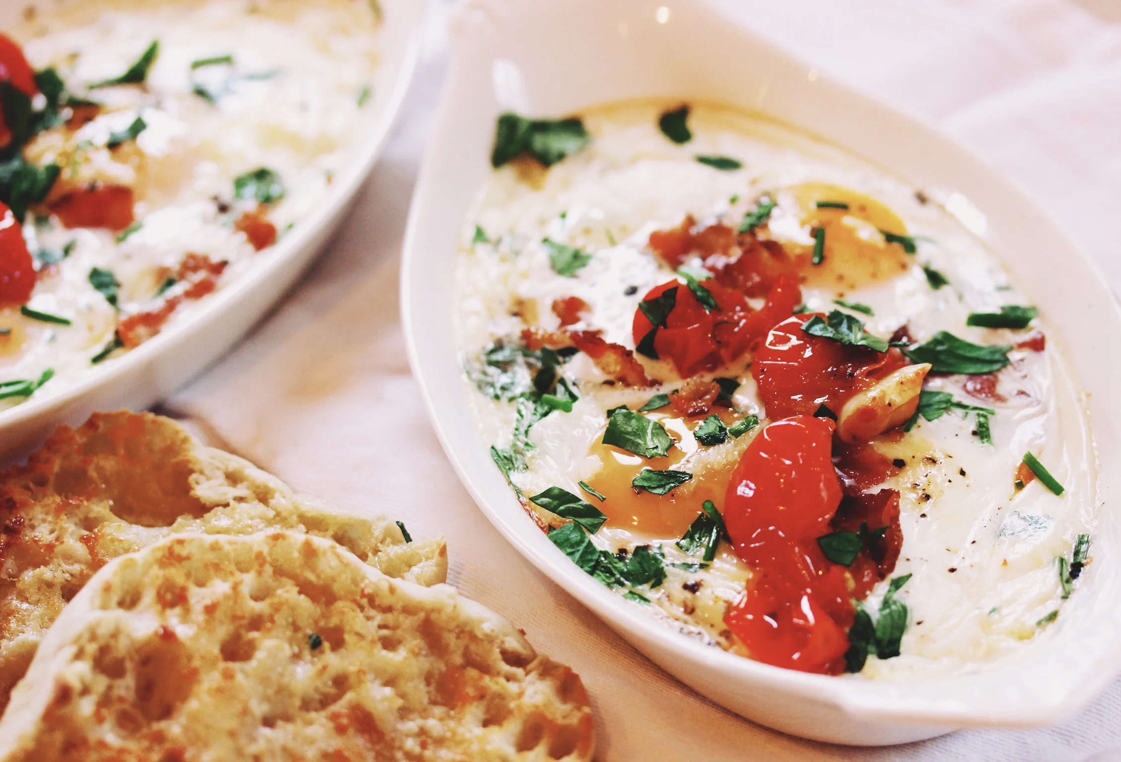 Baked eggs with blistered cherry tomatoes