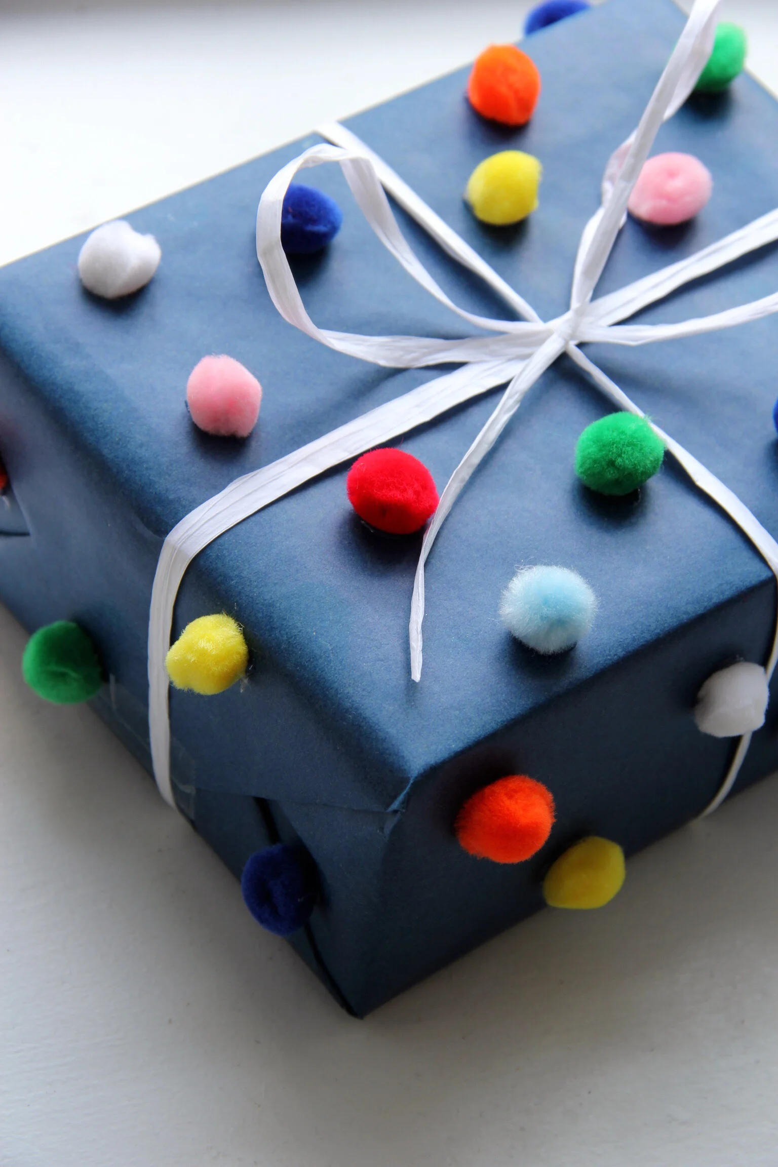 Pom pom gift wrap
