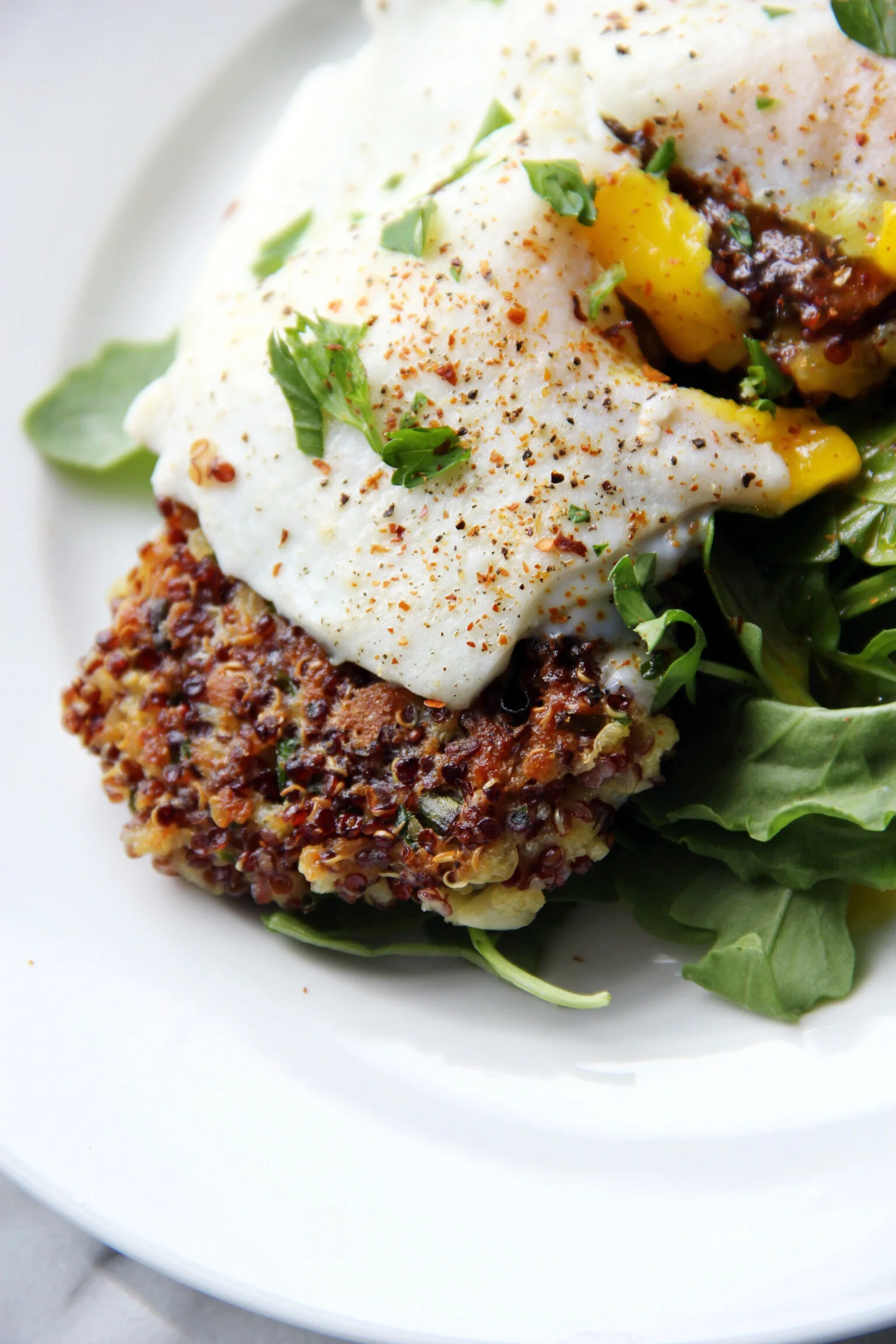 Quinoa cakes topped with a fried egg