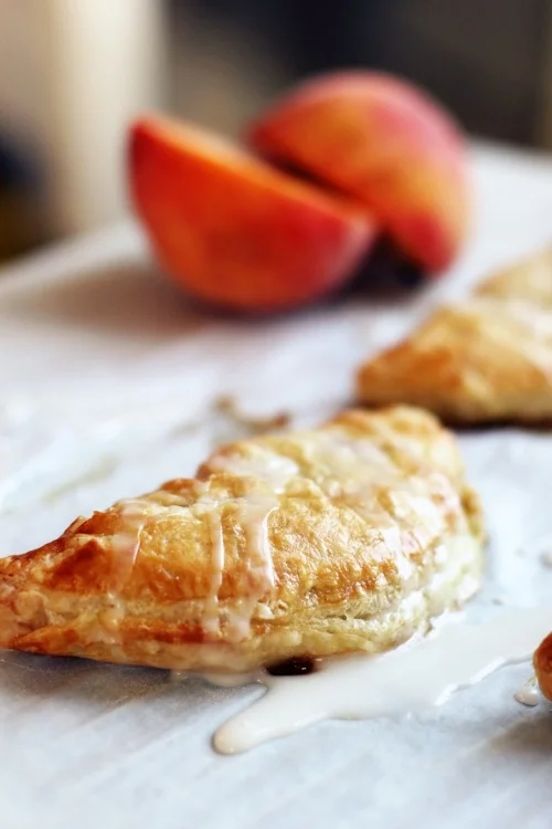 Peach turnovers with almond glaze