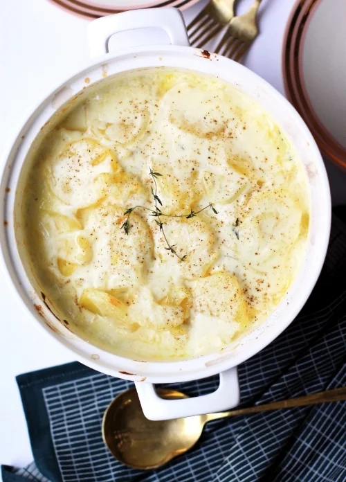 Old fashioned creamy scalloped potatoes with thyme