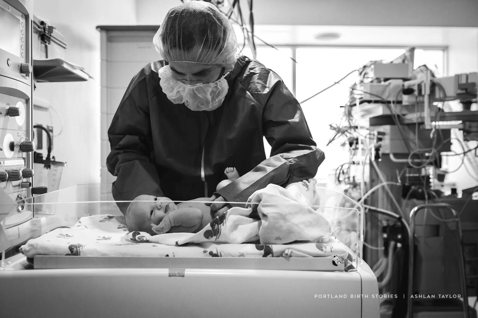 Father with new baby in the operating room after birth