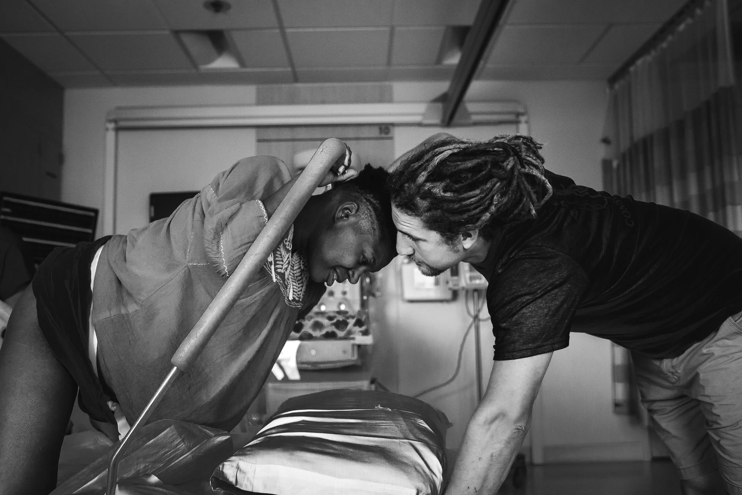 Mother in active labor before birthing her baby