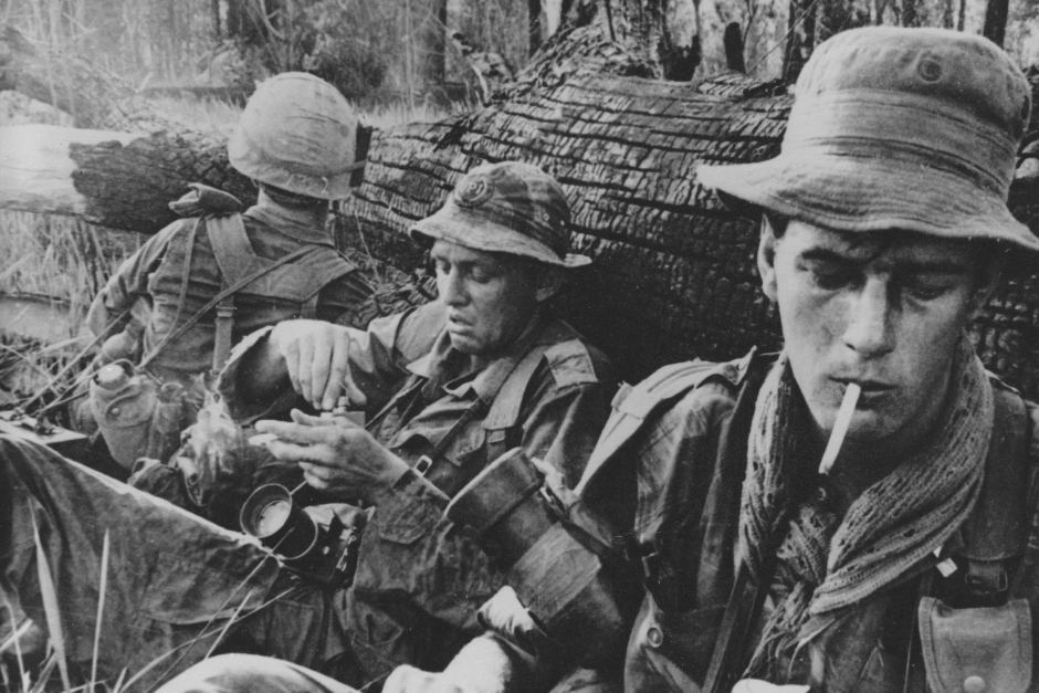Tim Page (far right) in the field