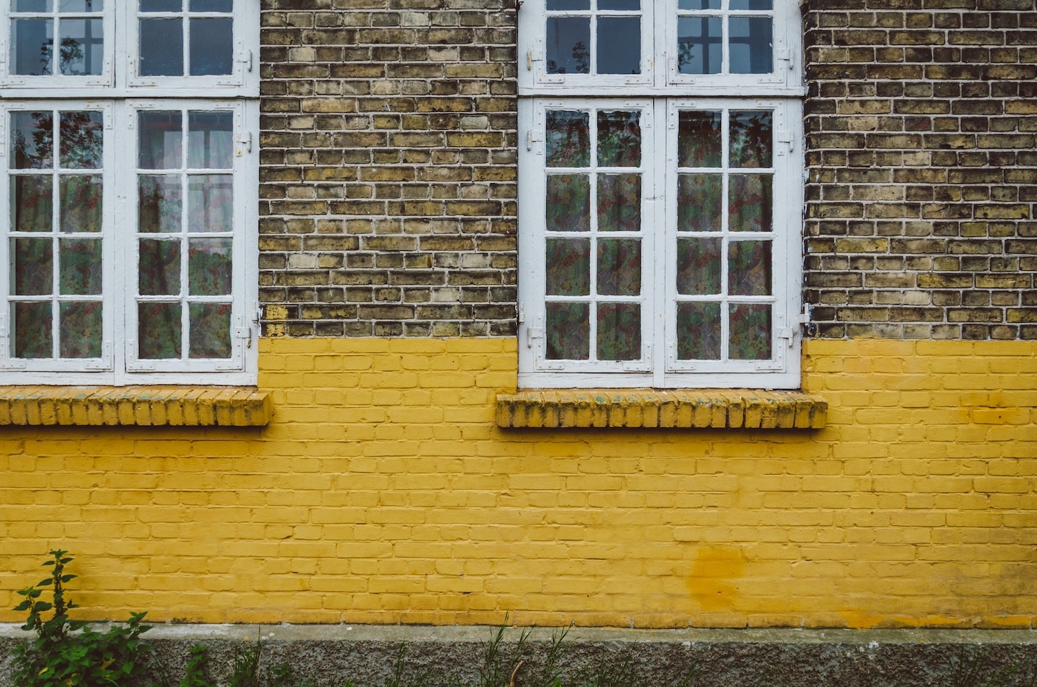 bricks-painted-yellow-white-trim-windows.jpg